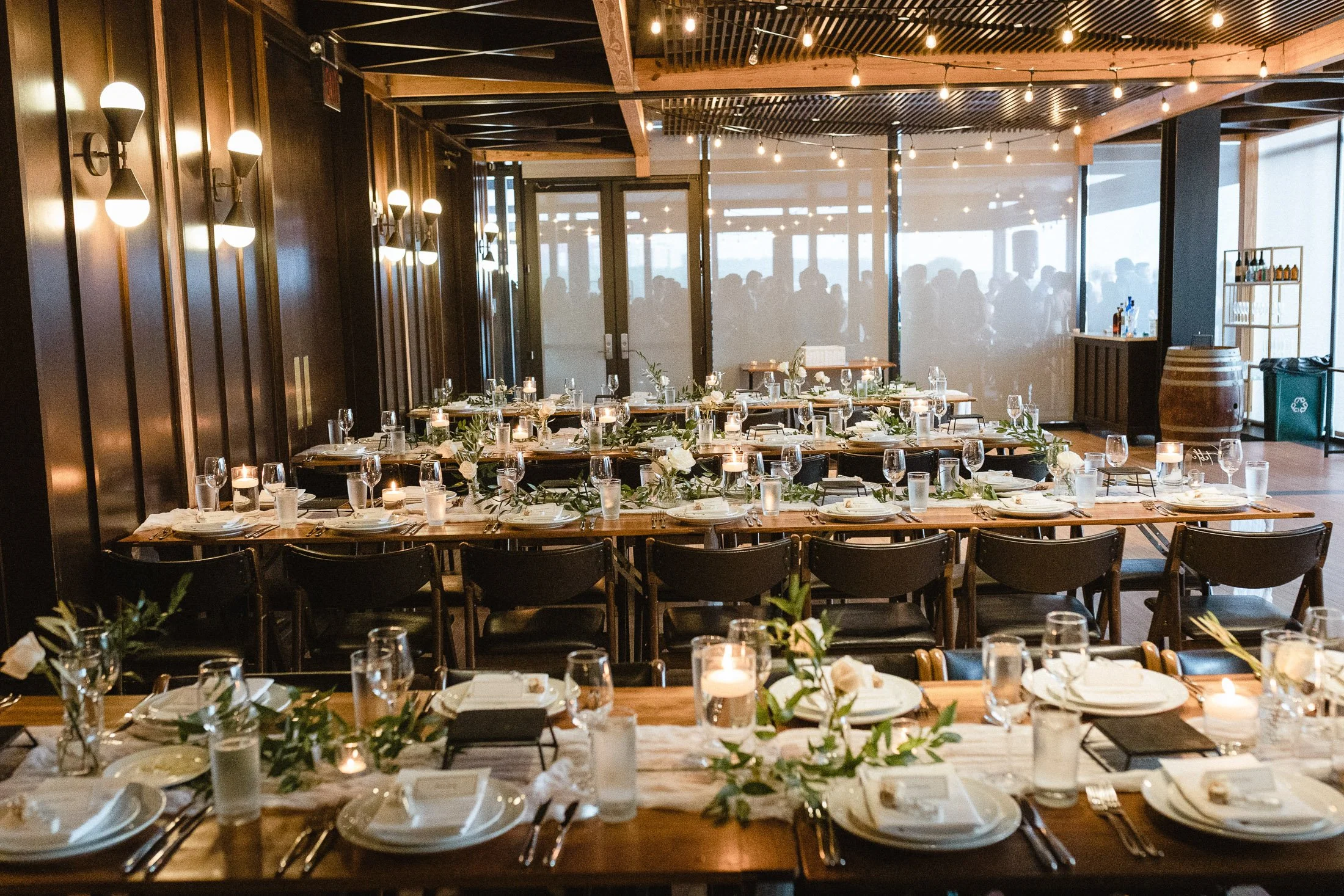Reception table settings and floral details at District Winery wedding reception