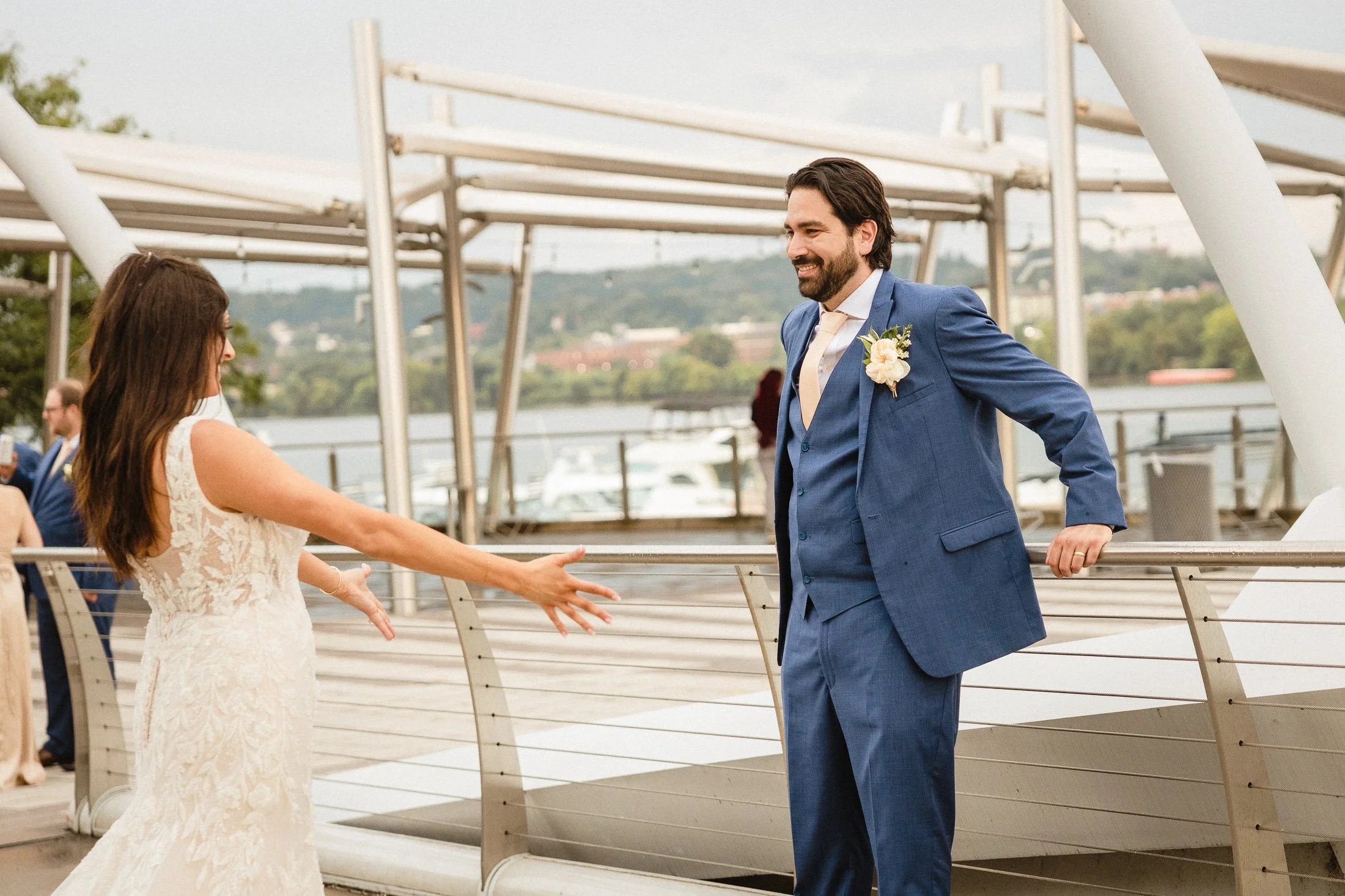 Bride and groom sharing waterfront first look at District Winery in Washington DC