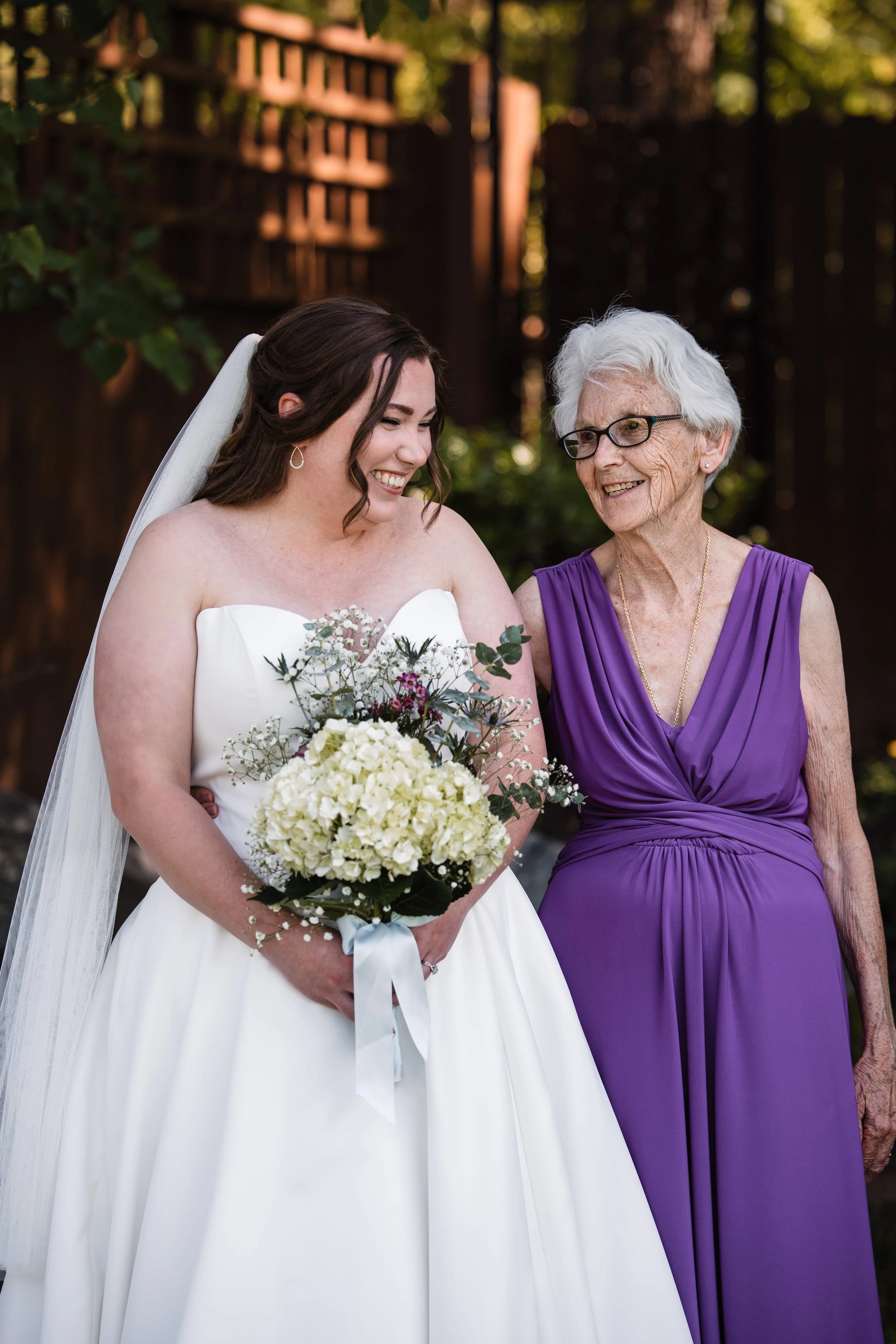 Bride sharing a quiet moment with her grandmother during a spring wedding at Persimmon Creek Barn in Beaverdam, Virginia.