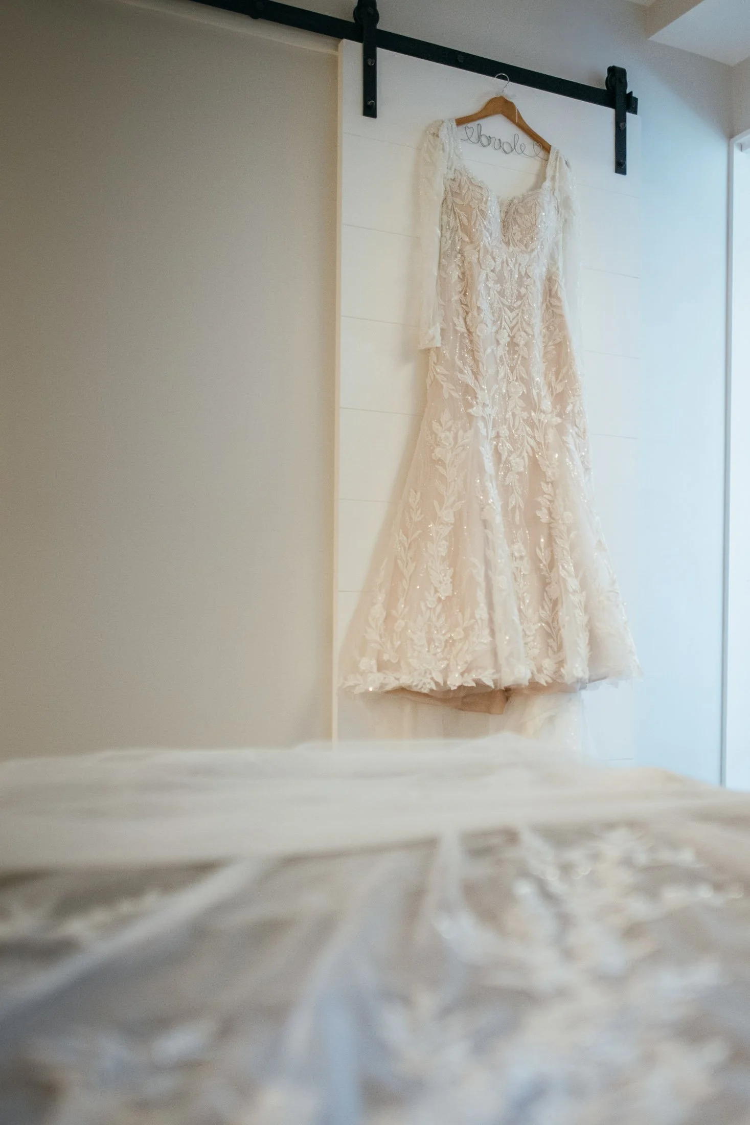 Bride’s wedding dress hanging in hotel suite before Washington DC wedding day preparations