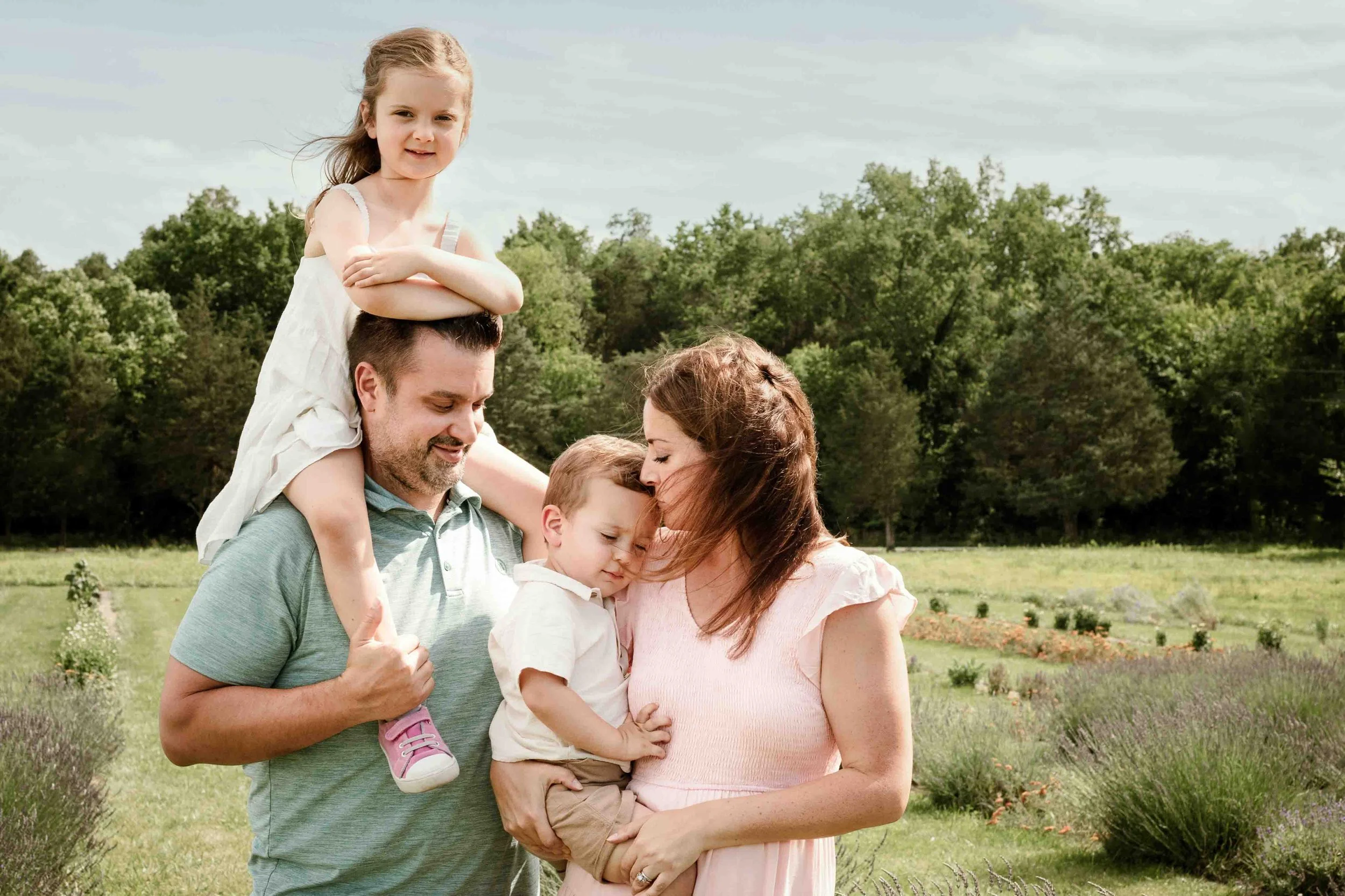 Family of four during a storytelling summer session at Seven Oaks Lavender Farm in Fauquier County, Virginia.