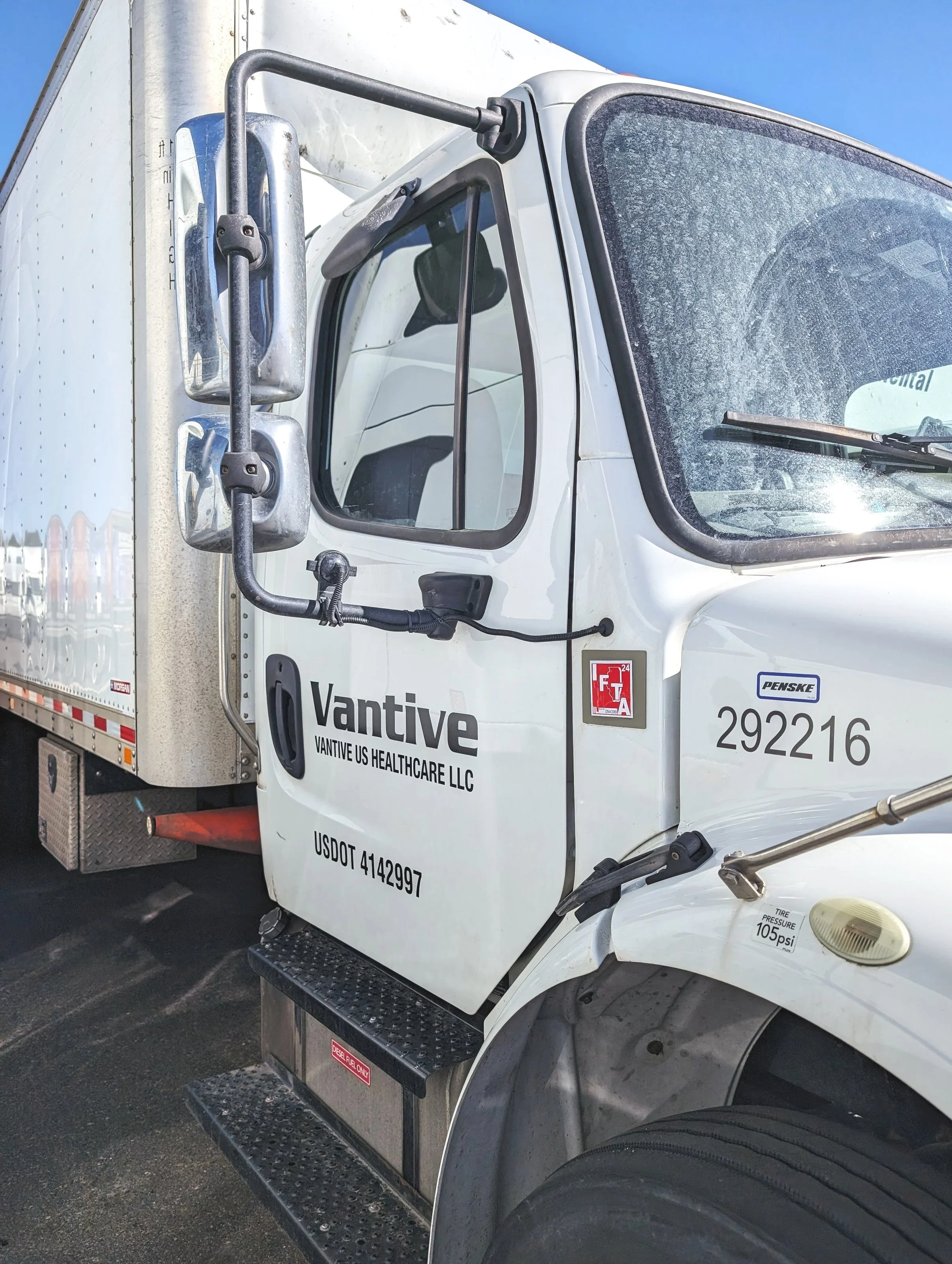 Delivery truck with "Vantive US Healthcare LLC" branding parked outdoors