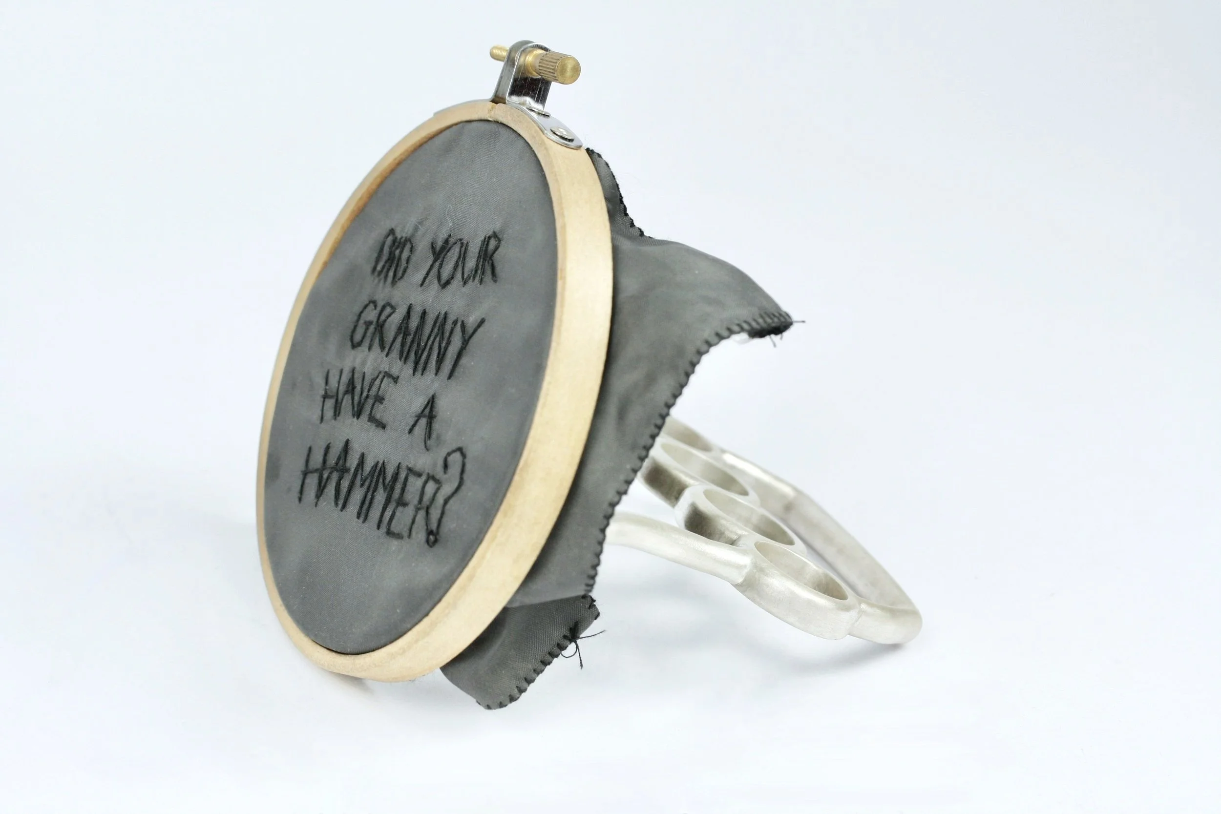 'now she's in mountjoy' silver, school skirt lining, embroidery hoop, thread.