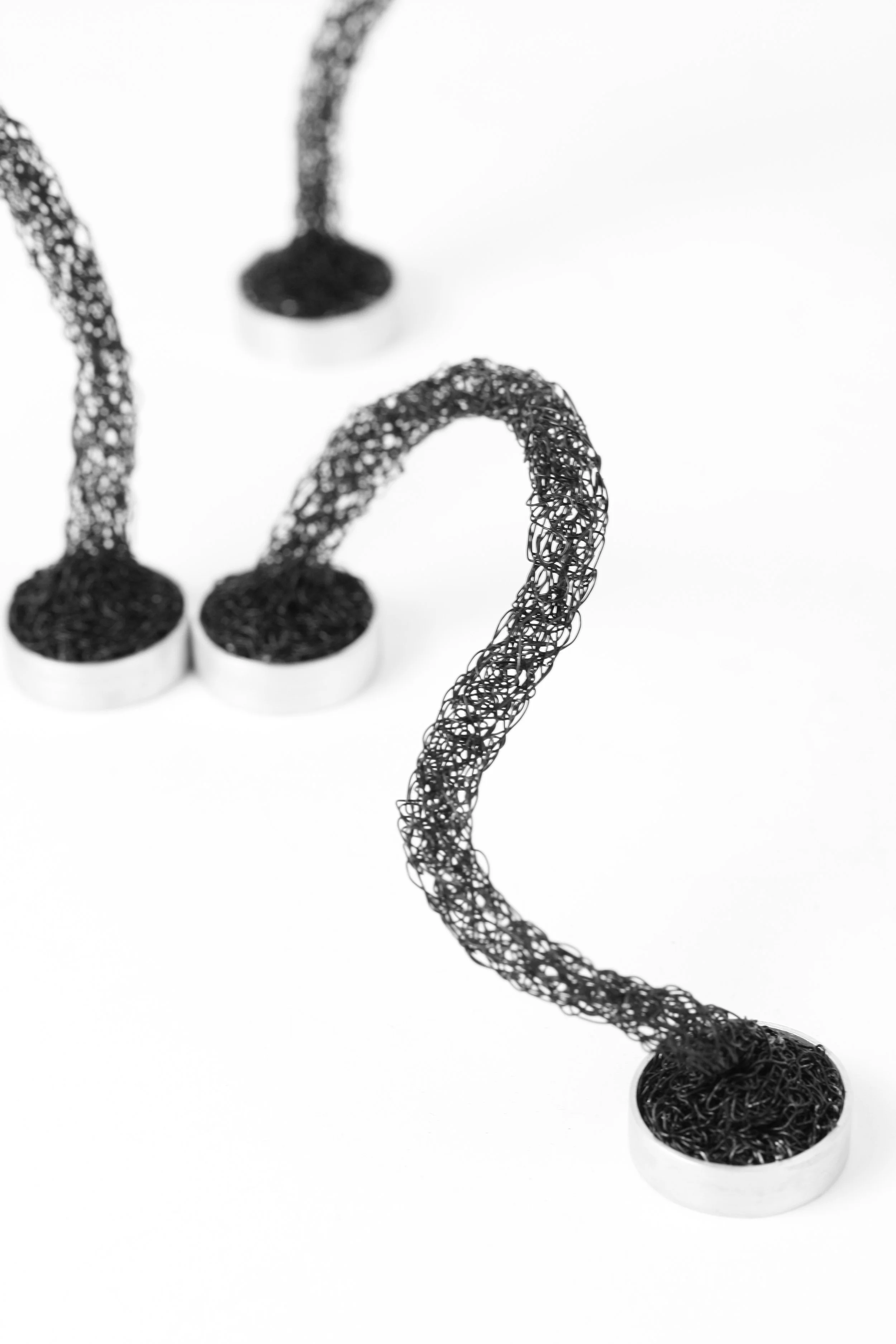 'hold my handle' necklace. 
copper wire (knitted), neodymium magnets, silver