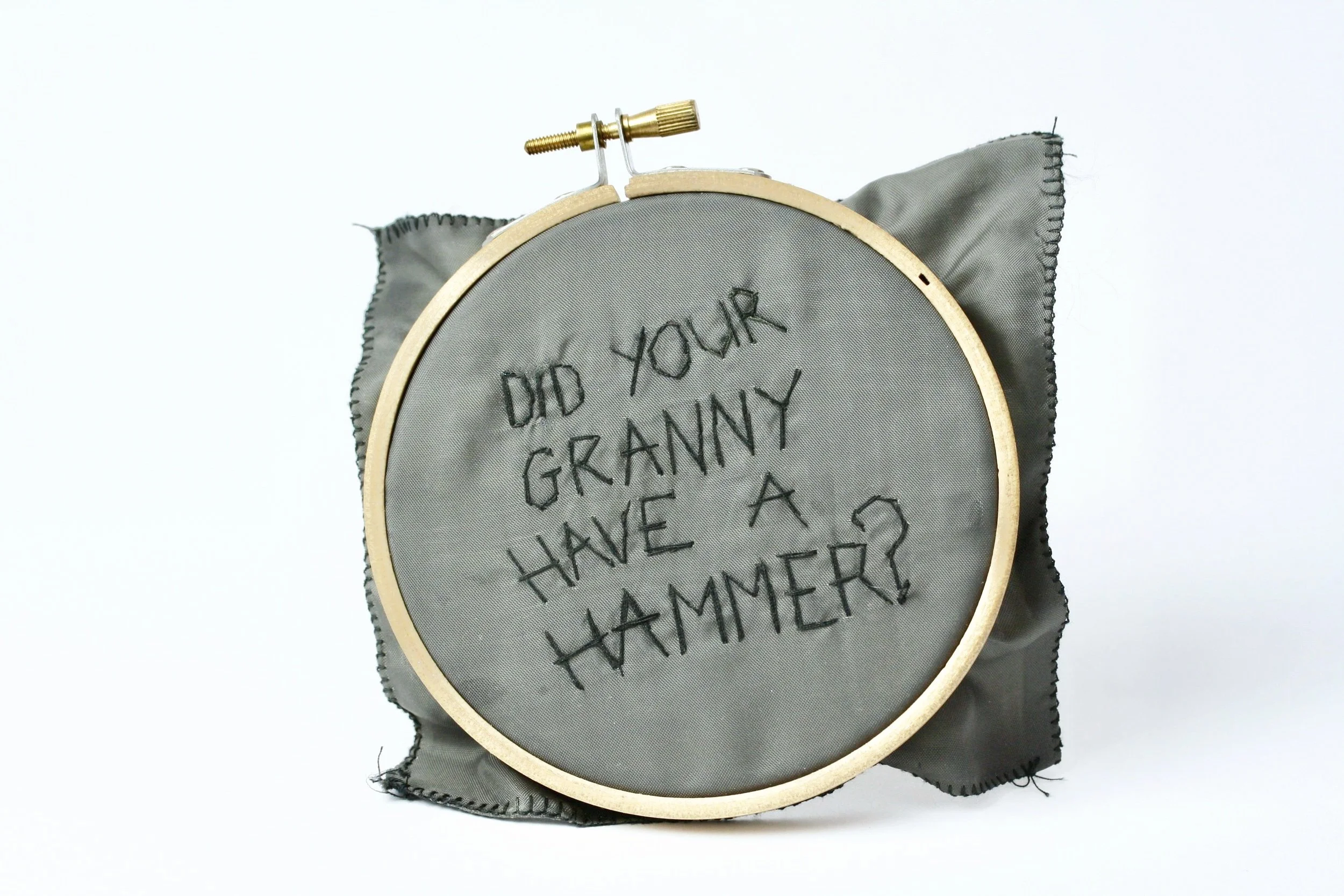 'now she's in mountjoy' silver, school skirt lining, embroidery hoop, thread.