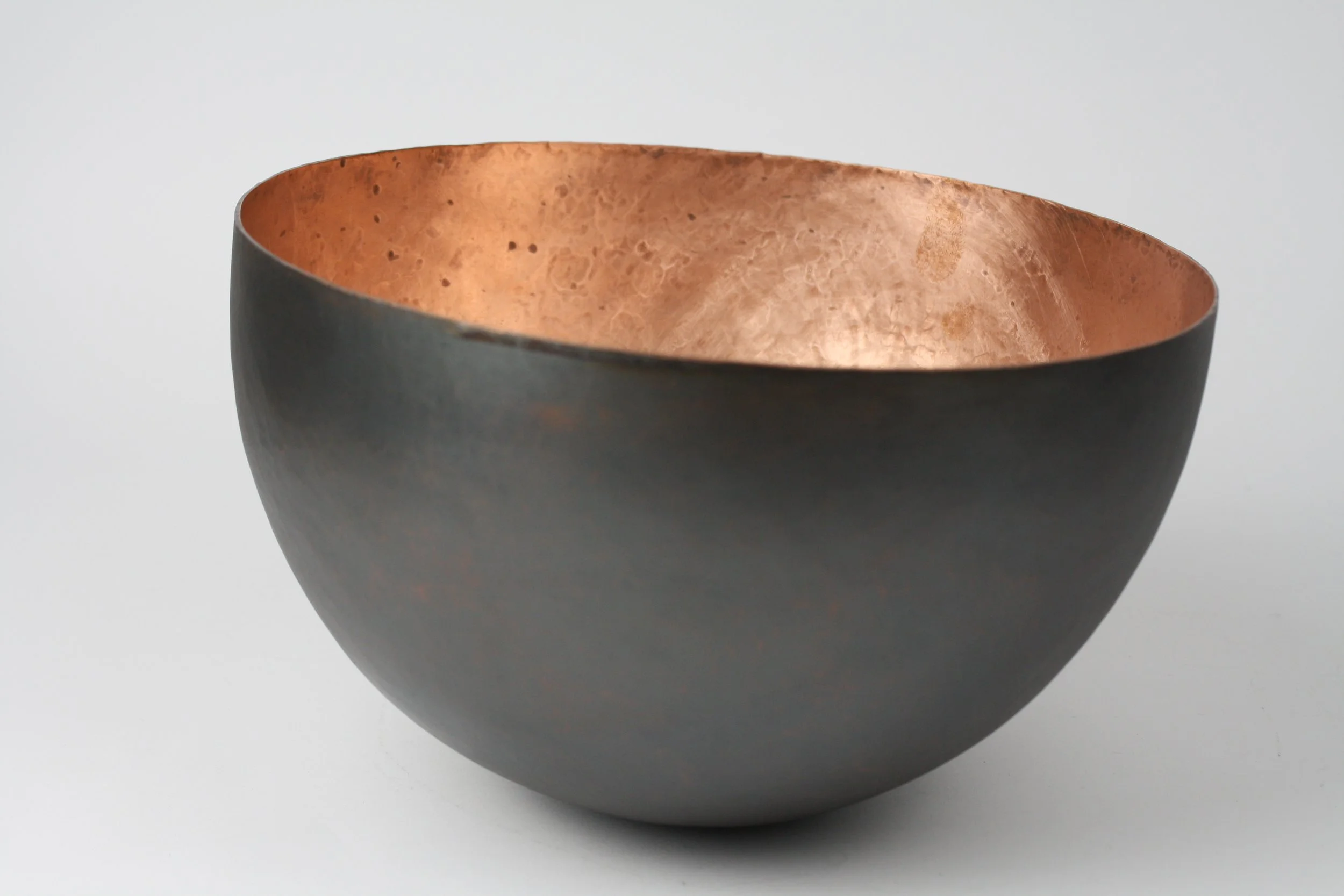 'brute force and determination' hammered vessel. copper