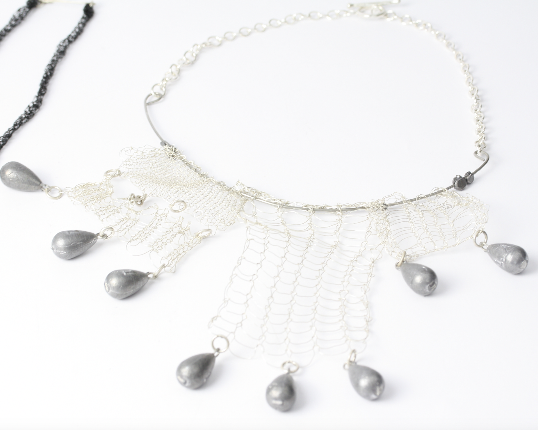 'gone knitting' necklace. silver, steel, lead weights.