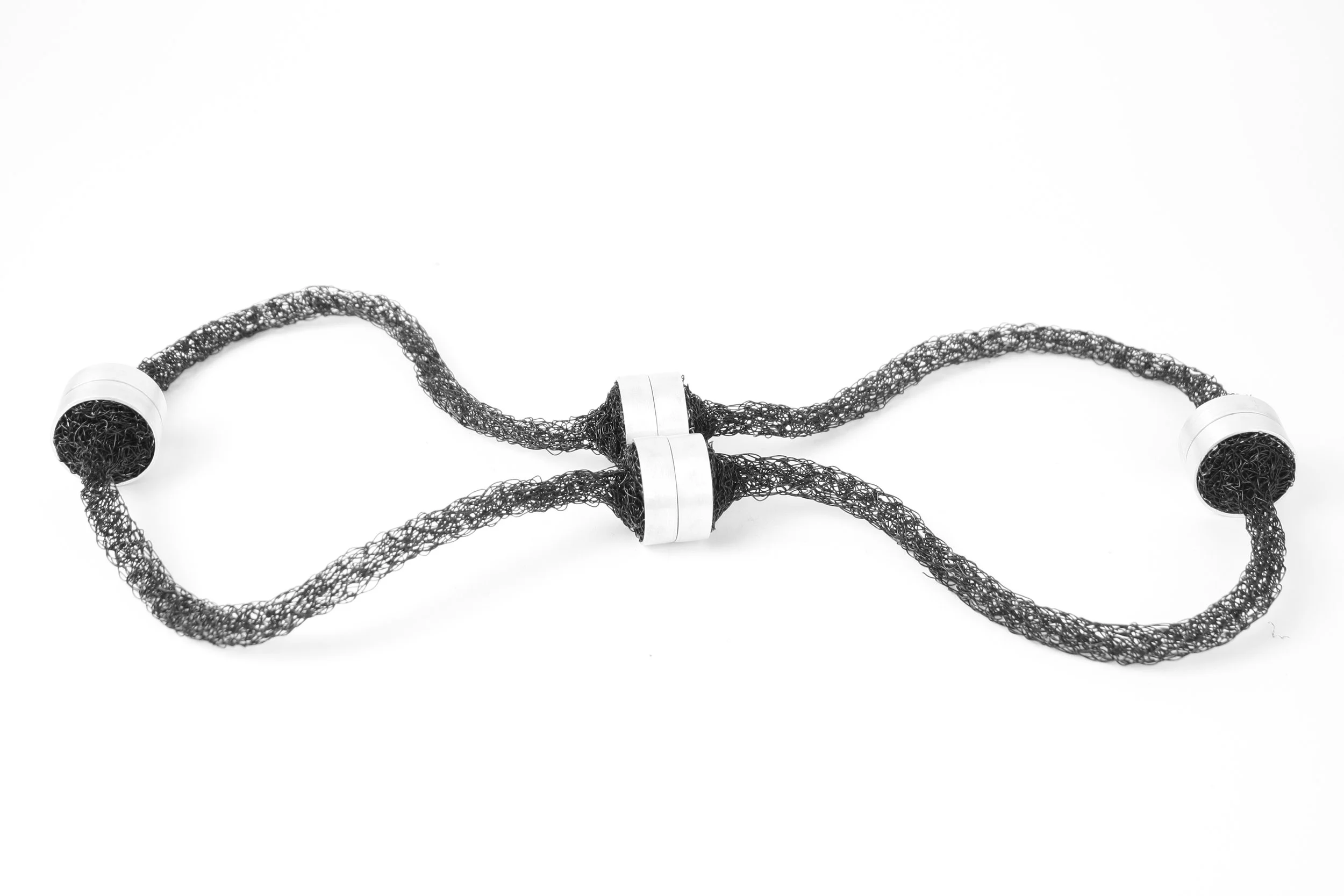 'hold my handle' necklace. 
copper wire (knitted), neodymium magnets, silver