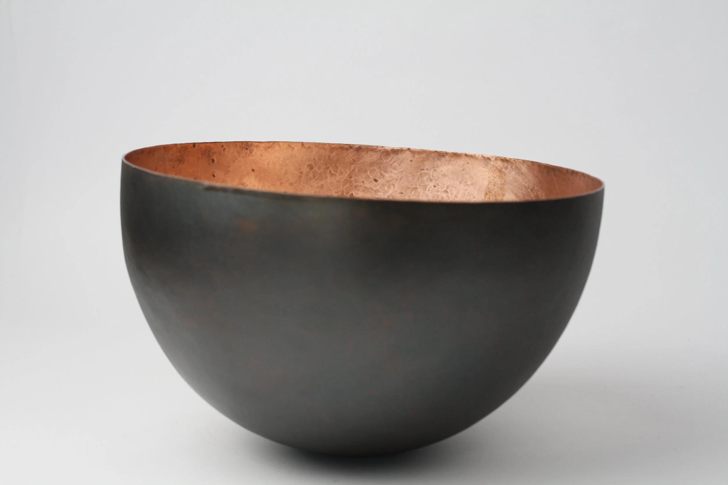 'brute force and determination' hammered vessel. copper