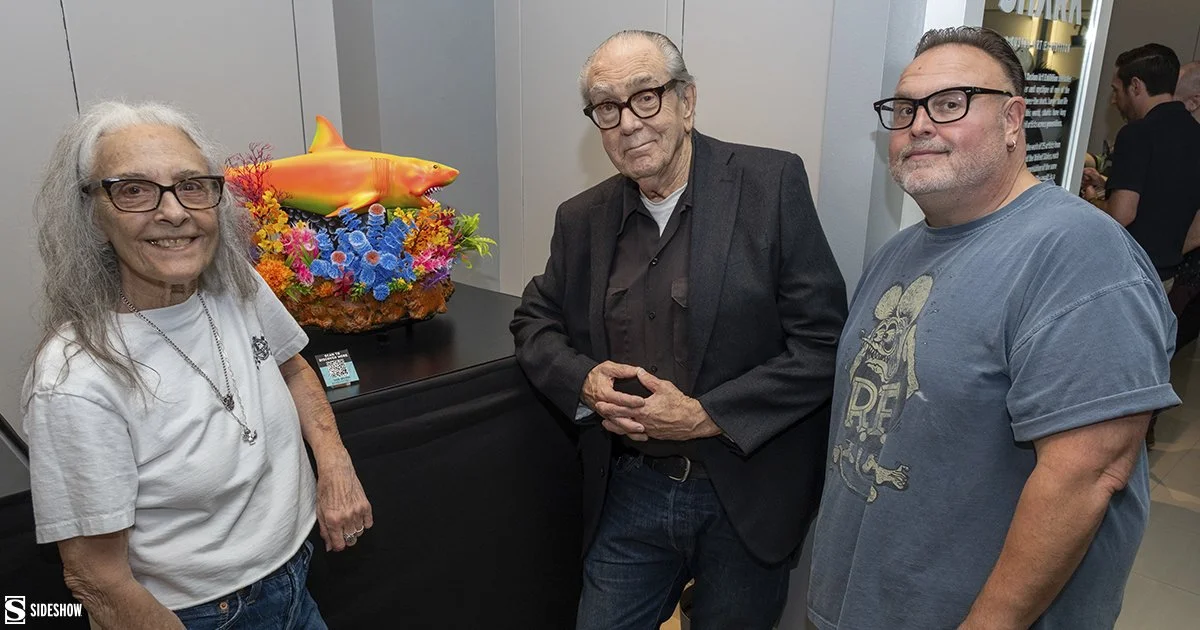 Artists-pose-with-their-colorful-floral-and-coral-reef-shark-at-Jumping-the-Shark.jpg