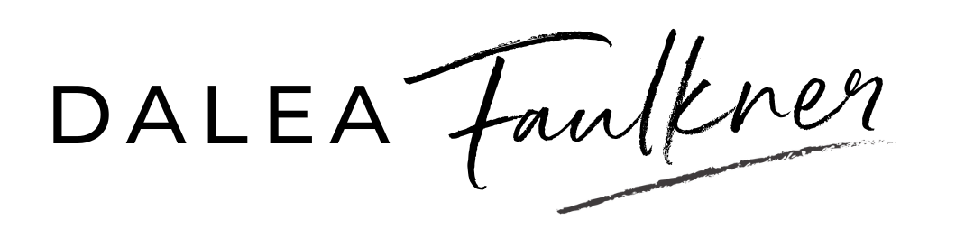 Dalea Faulkner logo Black ink brushstroke on a white background.