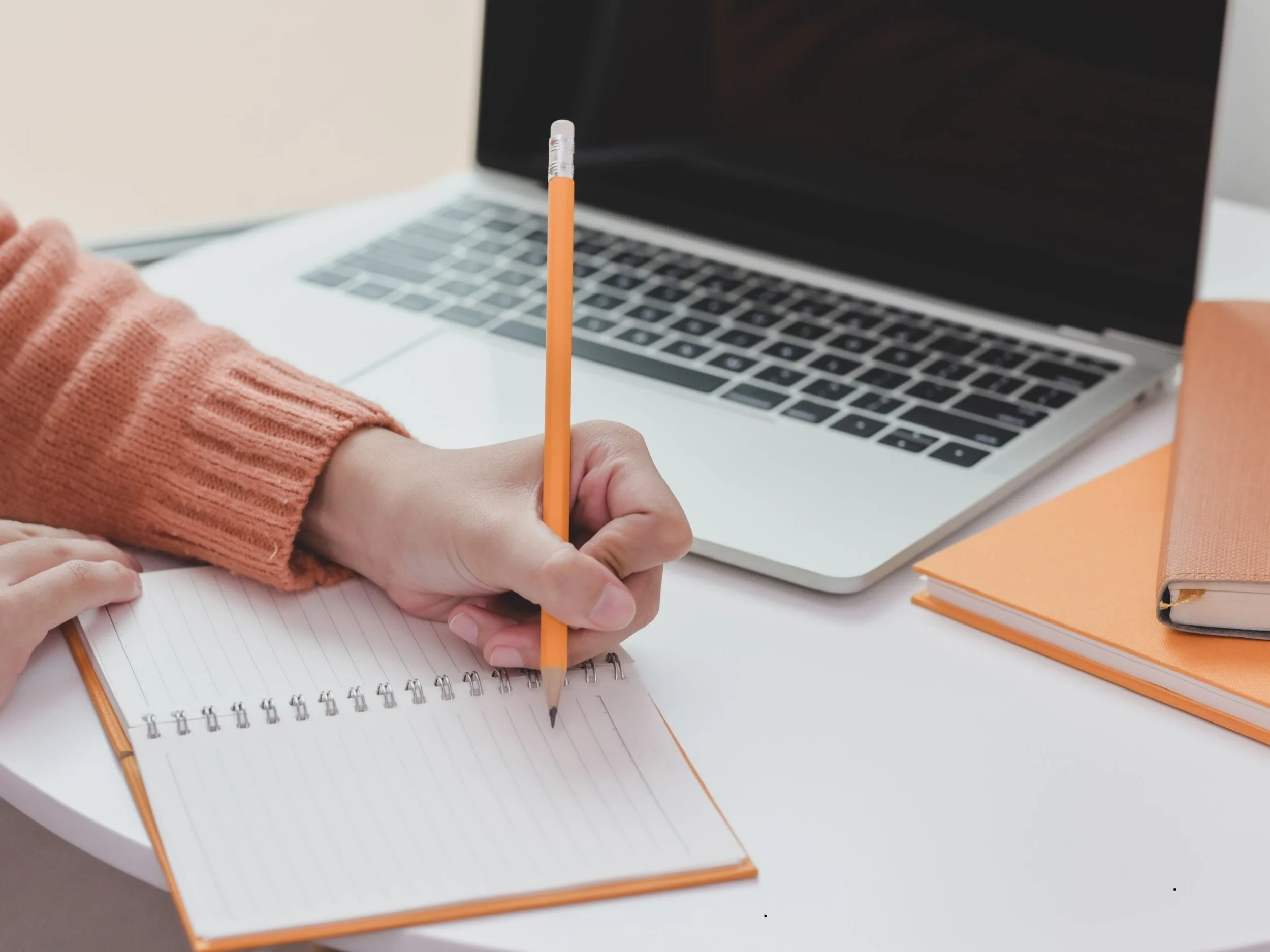 Hand typing on a computer, representing Package 1 – the Essentials Program for insurance support. Includes tools, templates, and a step-by-step guide to help navigate the insurance process with confidence.