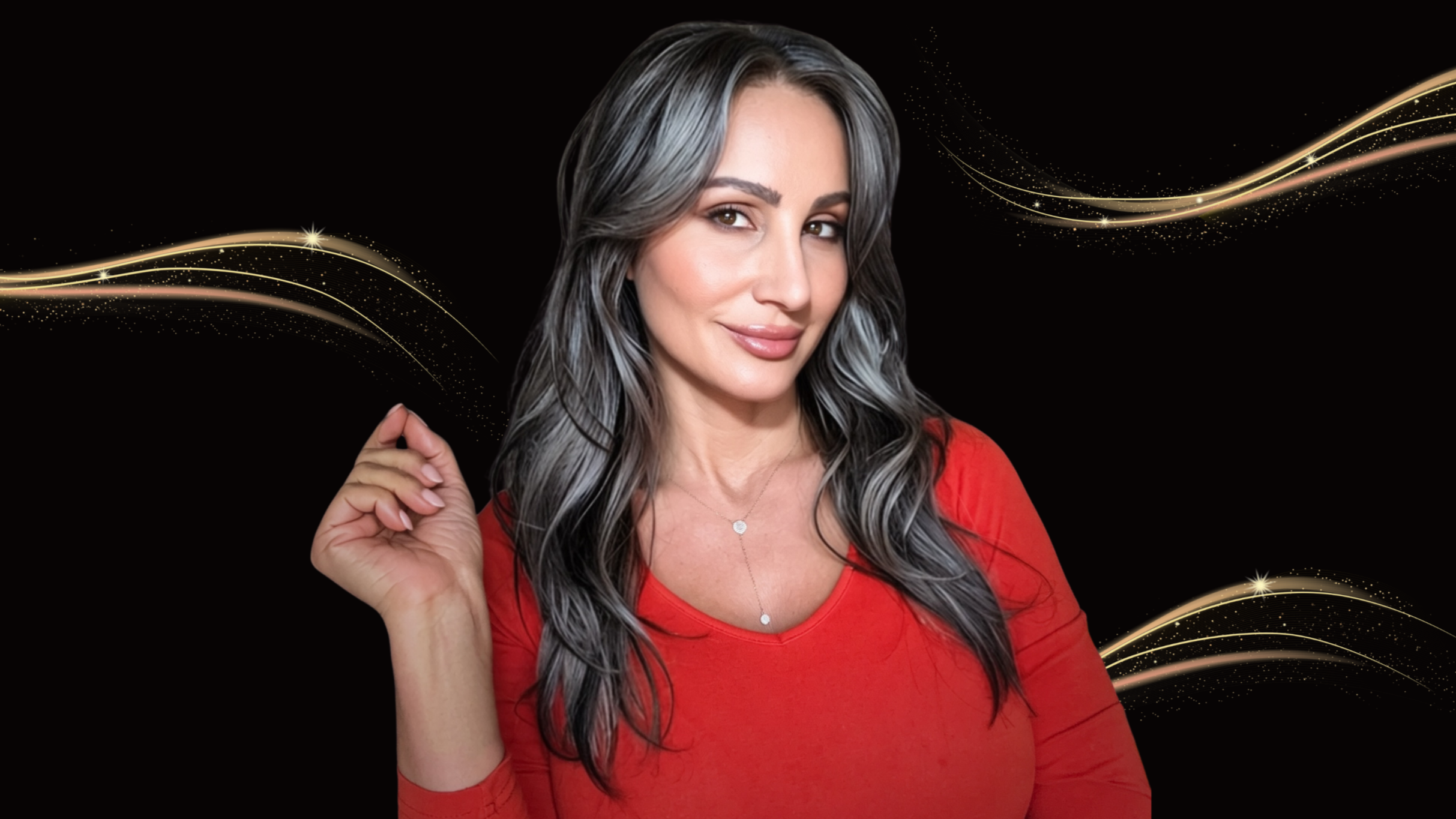 A woman with gray-black hair wearing a red top, smiling slightly, standing against a black background with swirling golden lines and sparkles.