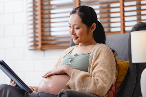 pregnant mother looking up resources on tablet