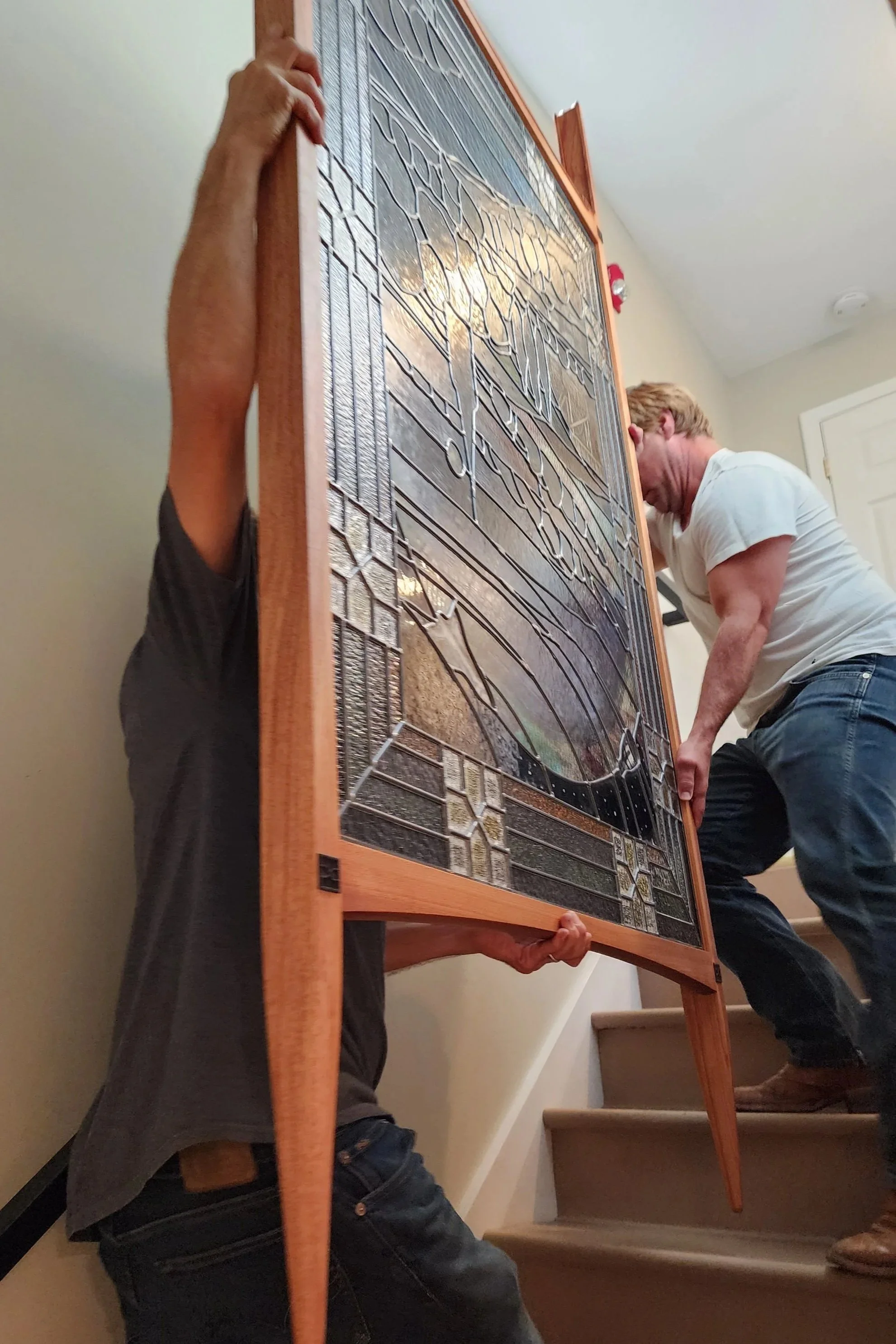 Delivering custom made solid wood frame to showcase leaded glass mosaic