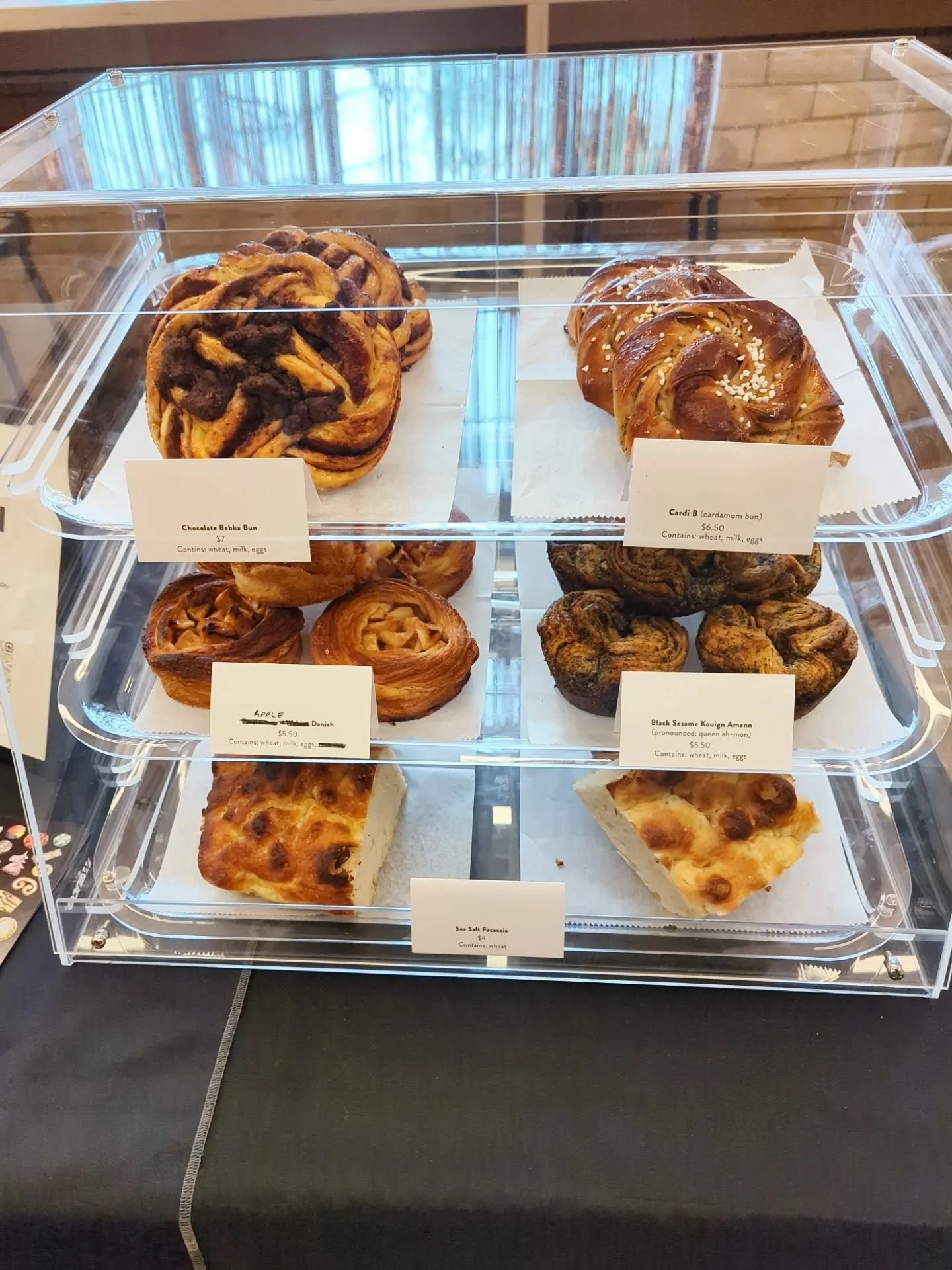 /// we're back at @studiotwothree today with a full case of pastries. Plus cookie boxes! Come get some.