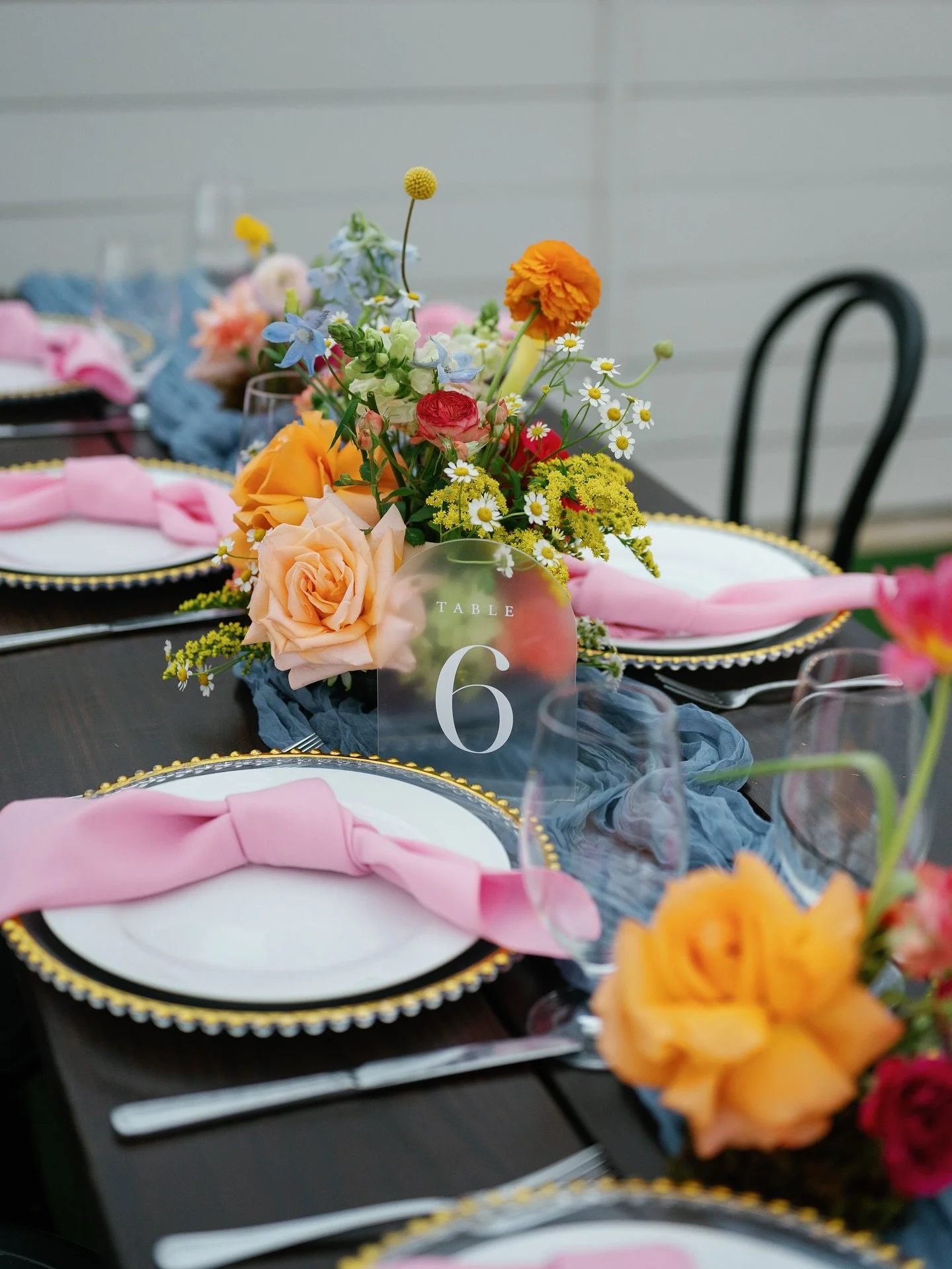 Jess &amp; Wil threw a wedding where color wasn&rsquo;t a suggestion&mdash;it was bible. This setup hit harder than your ex&rsquo;s apology &amp; looked way better doing it (sorry &lsquo;bout it🤷&zwj;♀️) 

Loud florals, extra streamers, and just a l