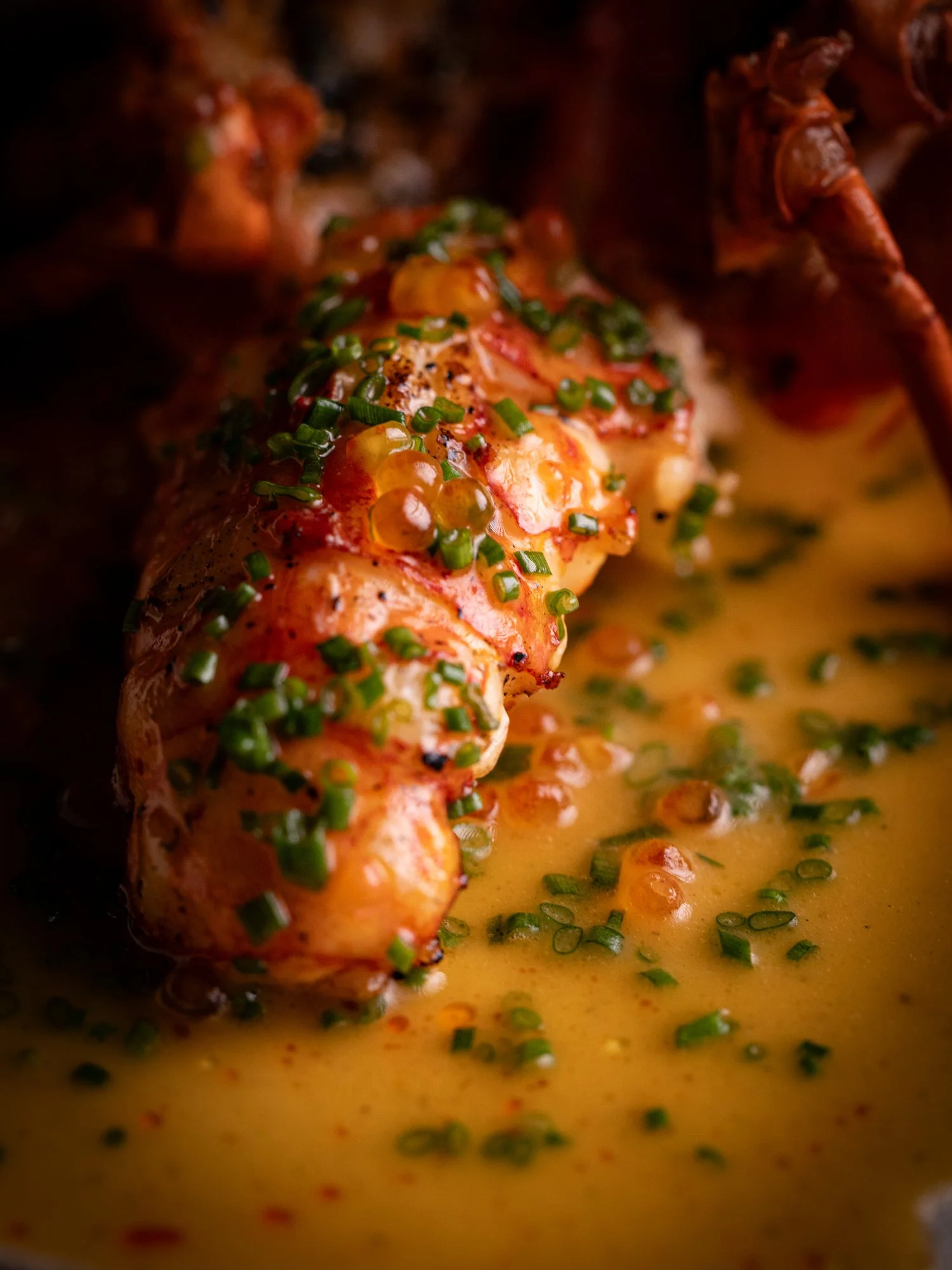 Flame-grilled WA Marron with trout roe butter, a delicate seafood dish
