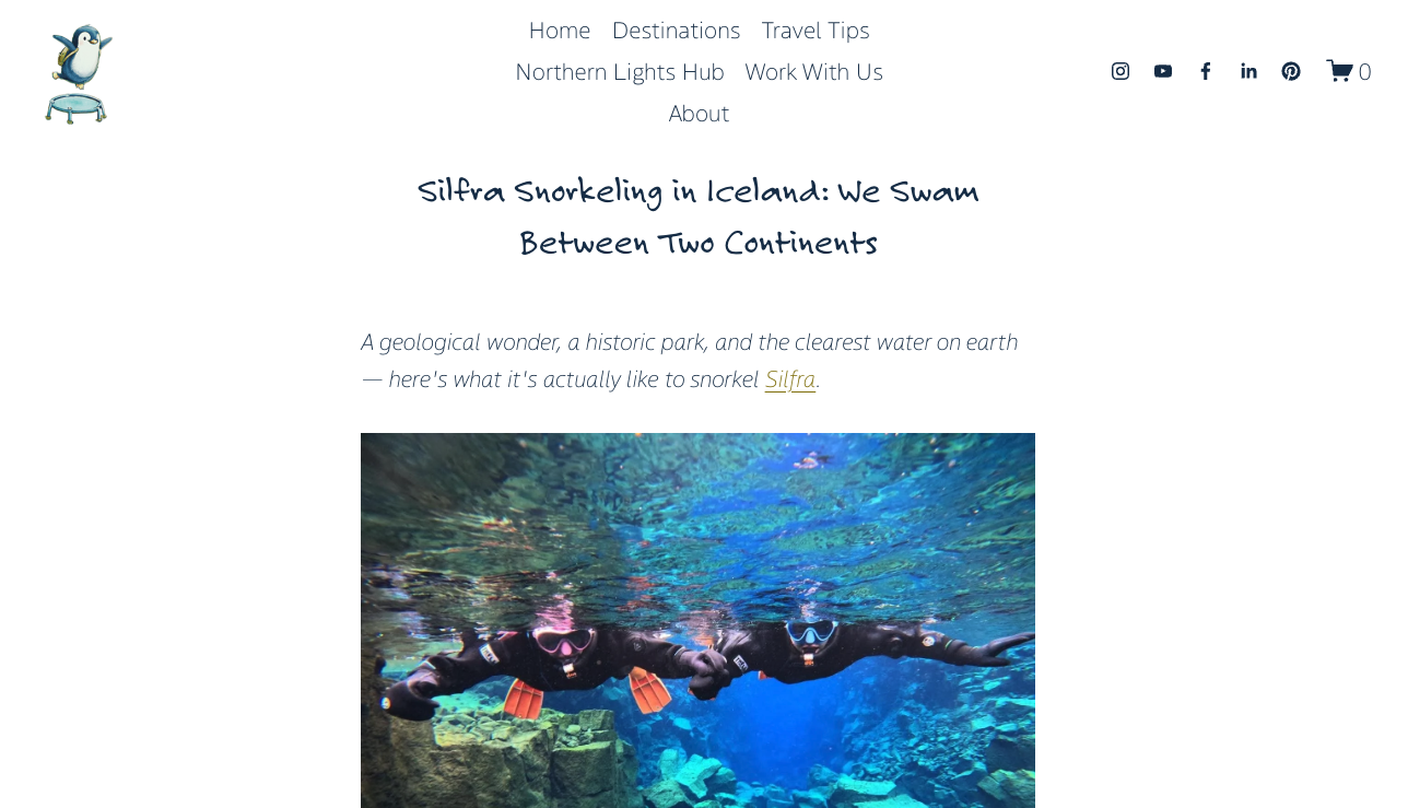 Two people snorkeling in Silfra, Iceland