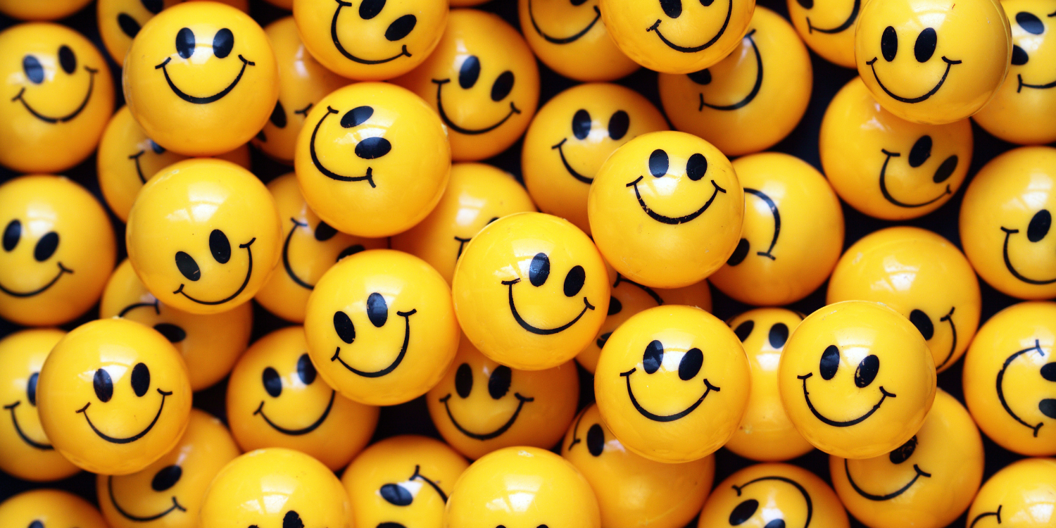 multiple yellow smiling stress balls