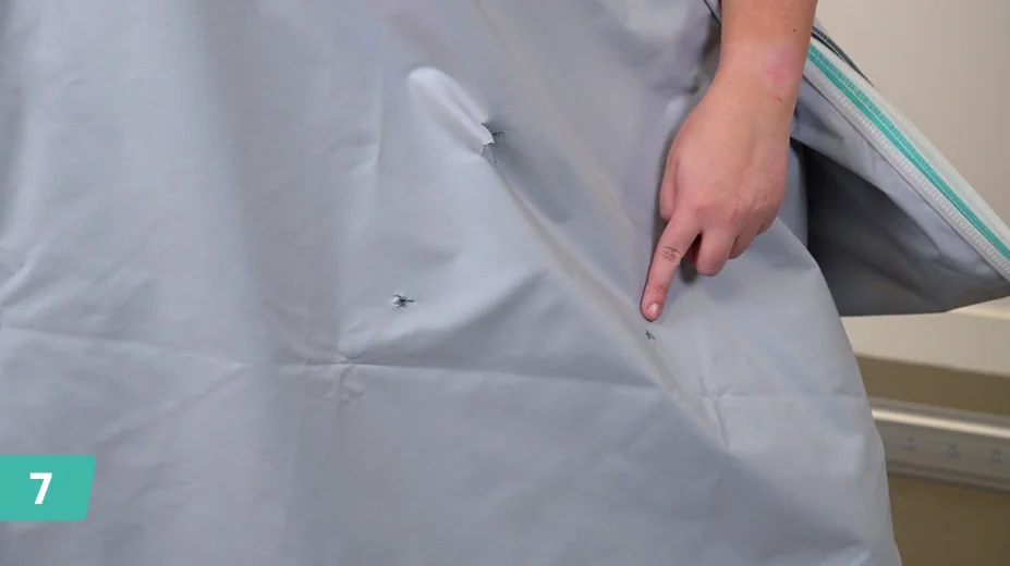 Locate the front graphic and check the pre-cut holes.