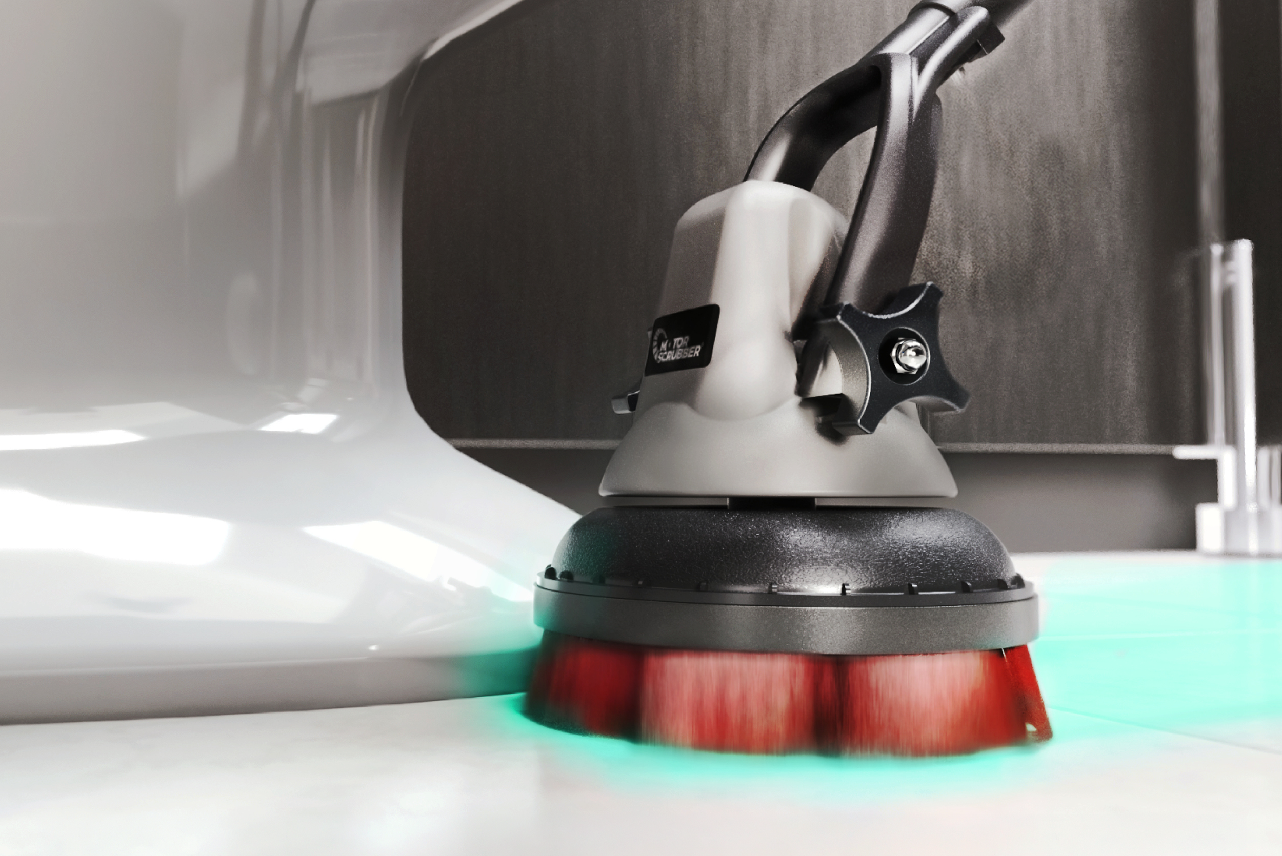 Close-up of the MotorScrubber M3 scrubber head reaching beneath and around a toilet pedestal, enabling effective cleaning of hard-to-access washroom surfaces.