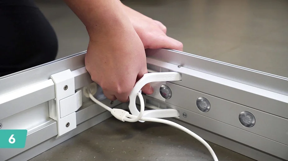 Connect the bottom pieces to the sides and connect the LED wiring.