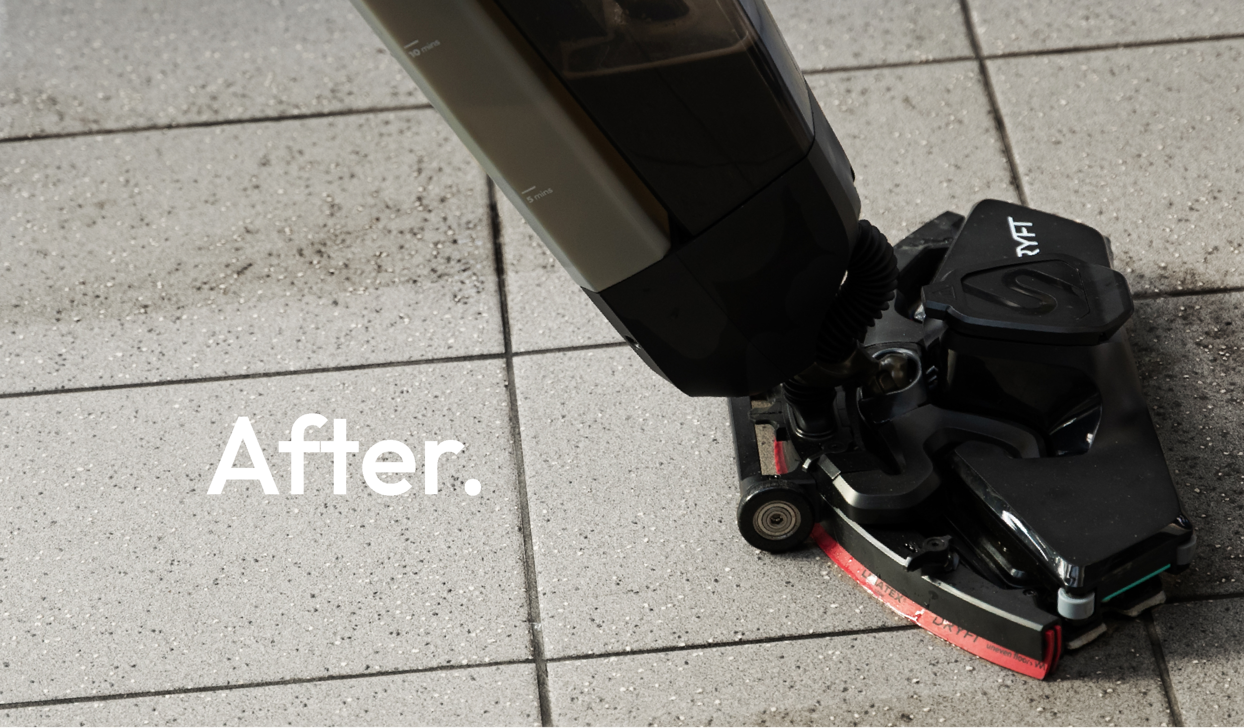 After cleaning: DRYFT leaves a visibly clean track on the textured station platform floor.