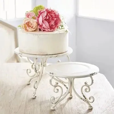 ROUND ORNATE METAL RISERS SET OF 2