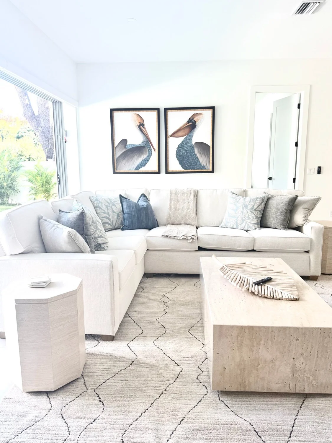 White-living-room-with-sectional-and-pelcan-art.jpg