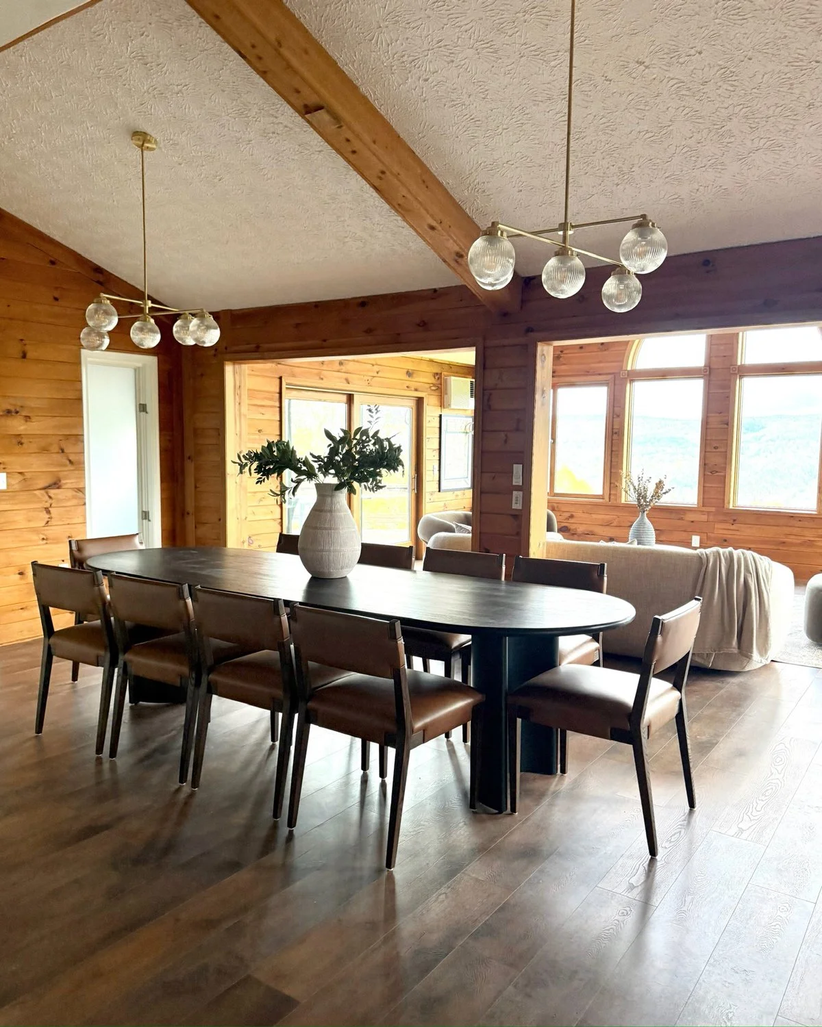 Dining-room-table-with2-bubble-light-fixtures-suspended-from-textured-white-ceiling.jpg