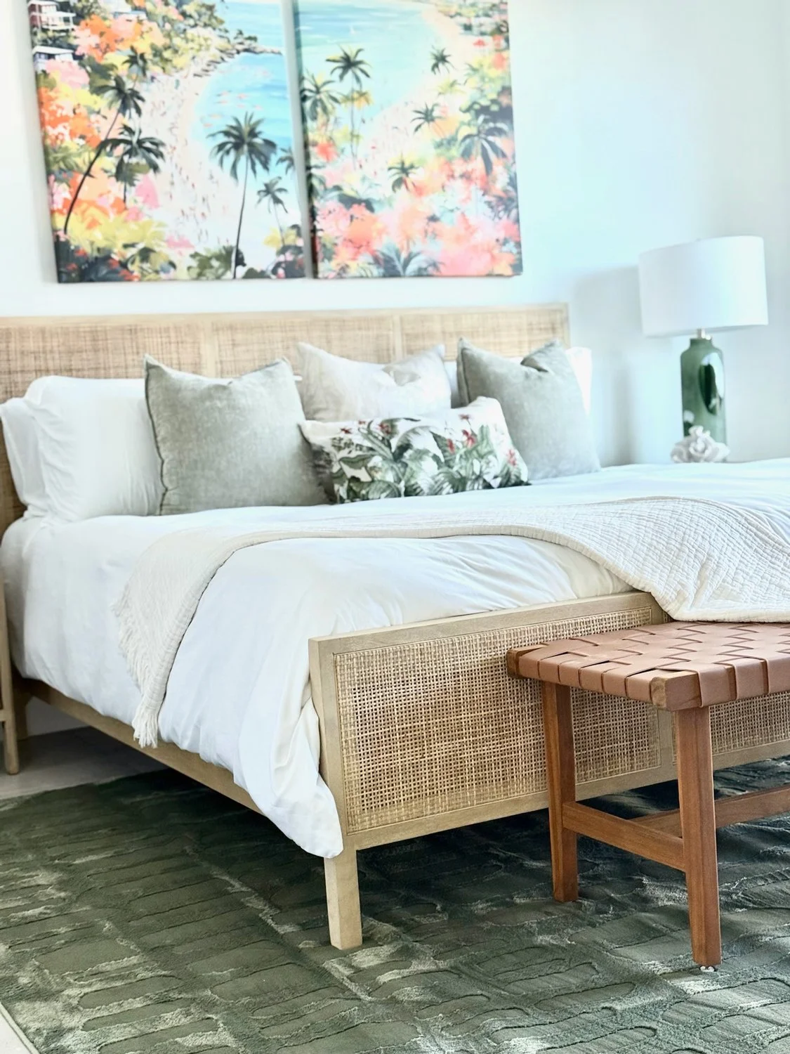 Light-bedoroom-with-white-bed-and-tropical-prints-behind.jpg