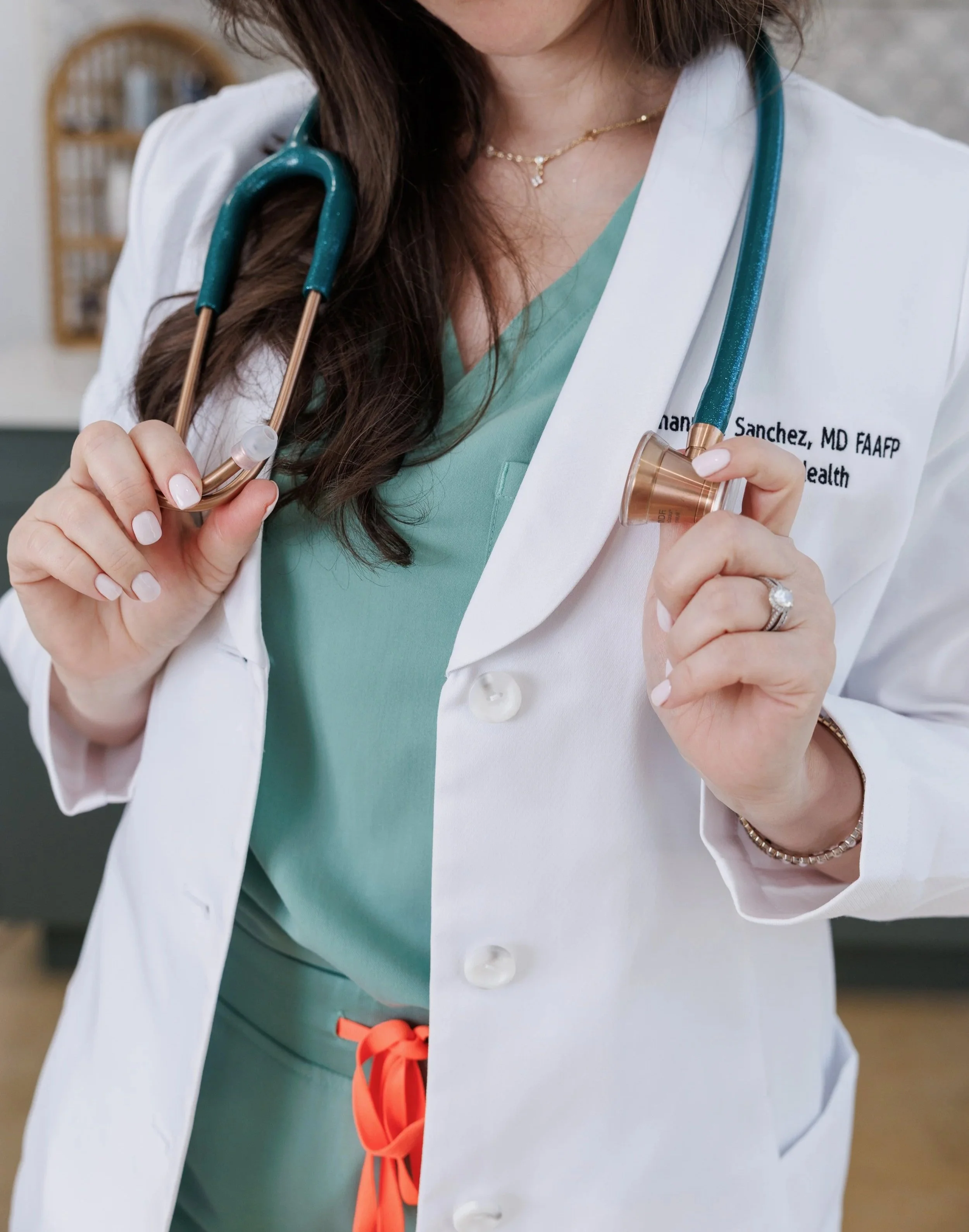 Miami direct primary care doctor holding equipment