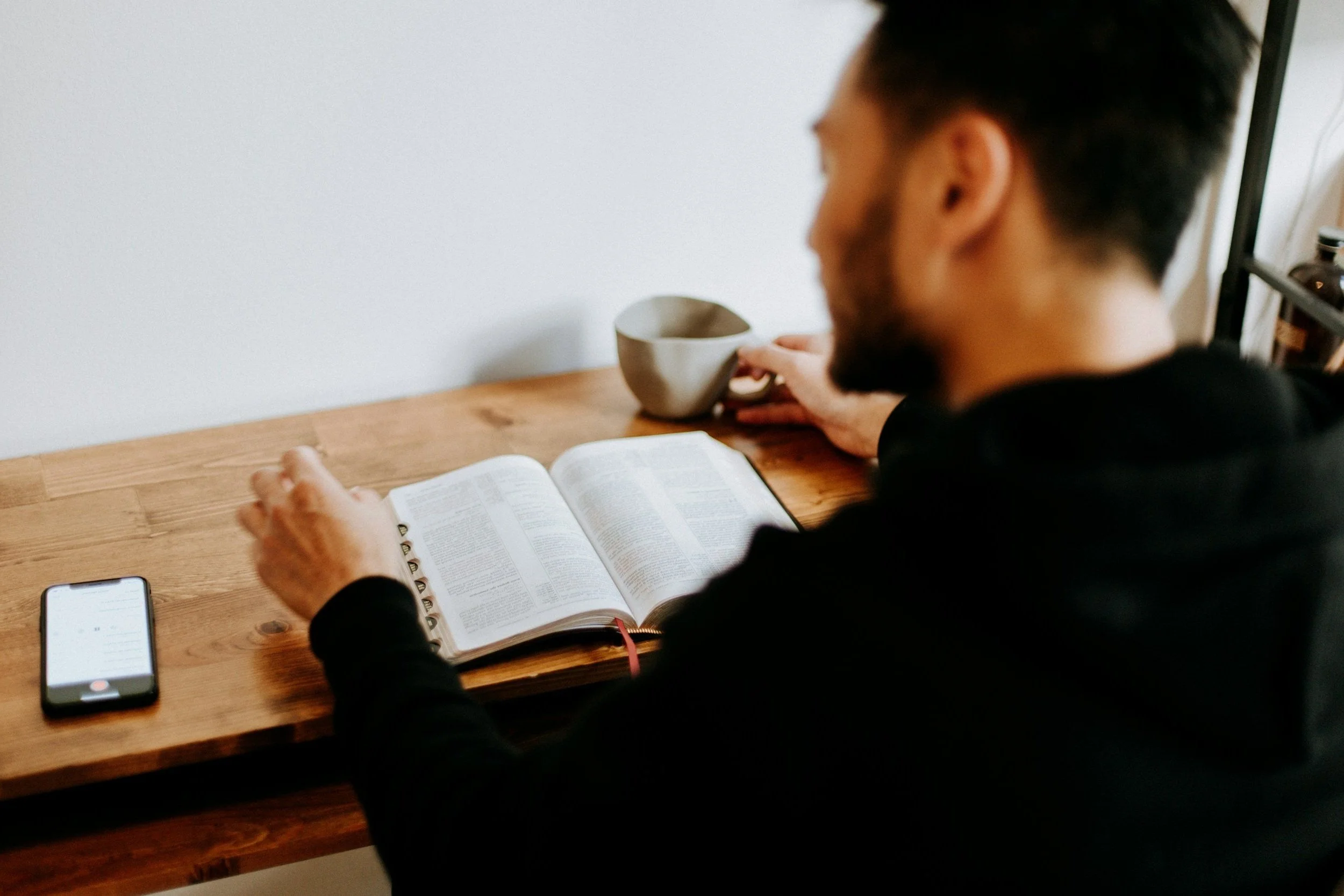 Man reading the Bible during an infertility and pregnancy loss Bible study