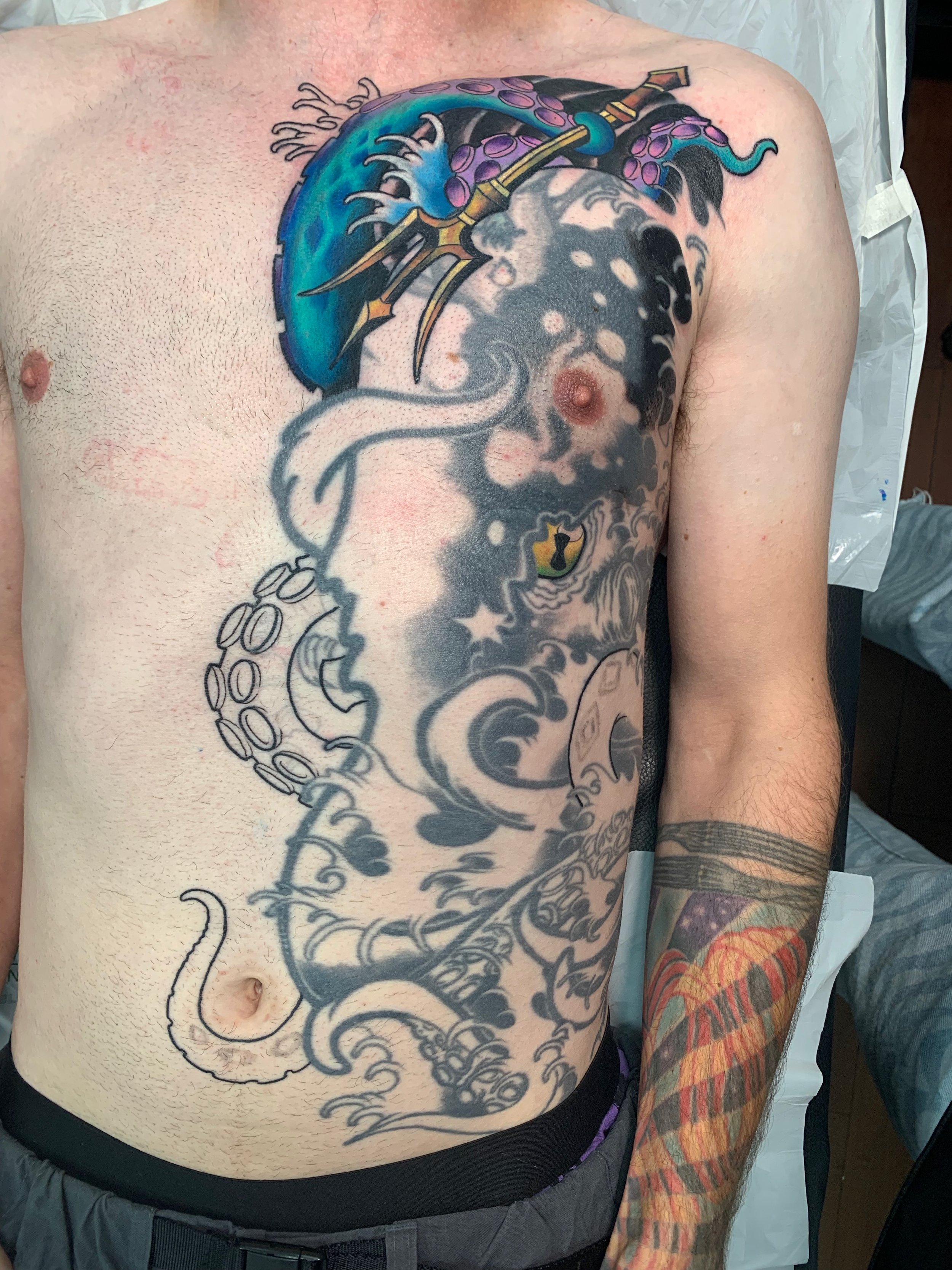 Session 2 - started the bold turquoise of the main kraken body, beginning on the pec.