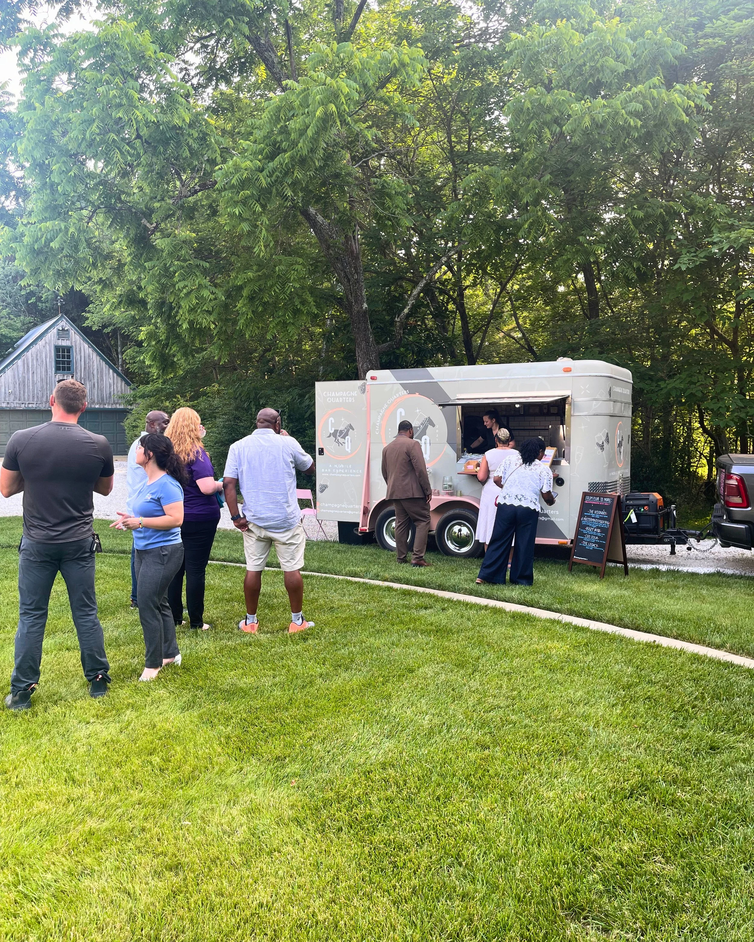 Guests enjoying beverage service from the horse trailer bar. Maryland mobile bar services.