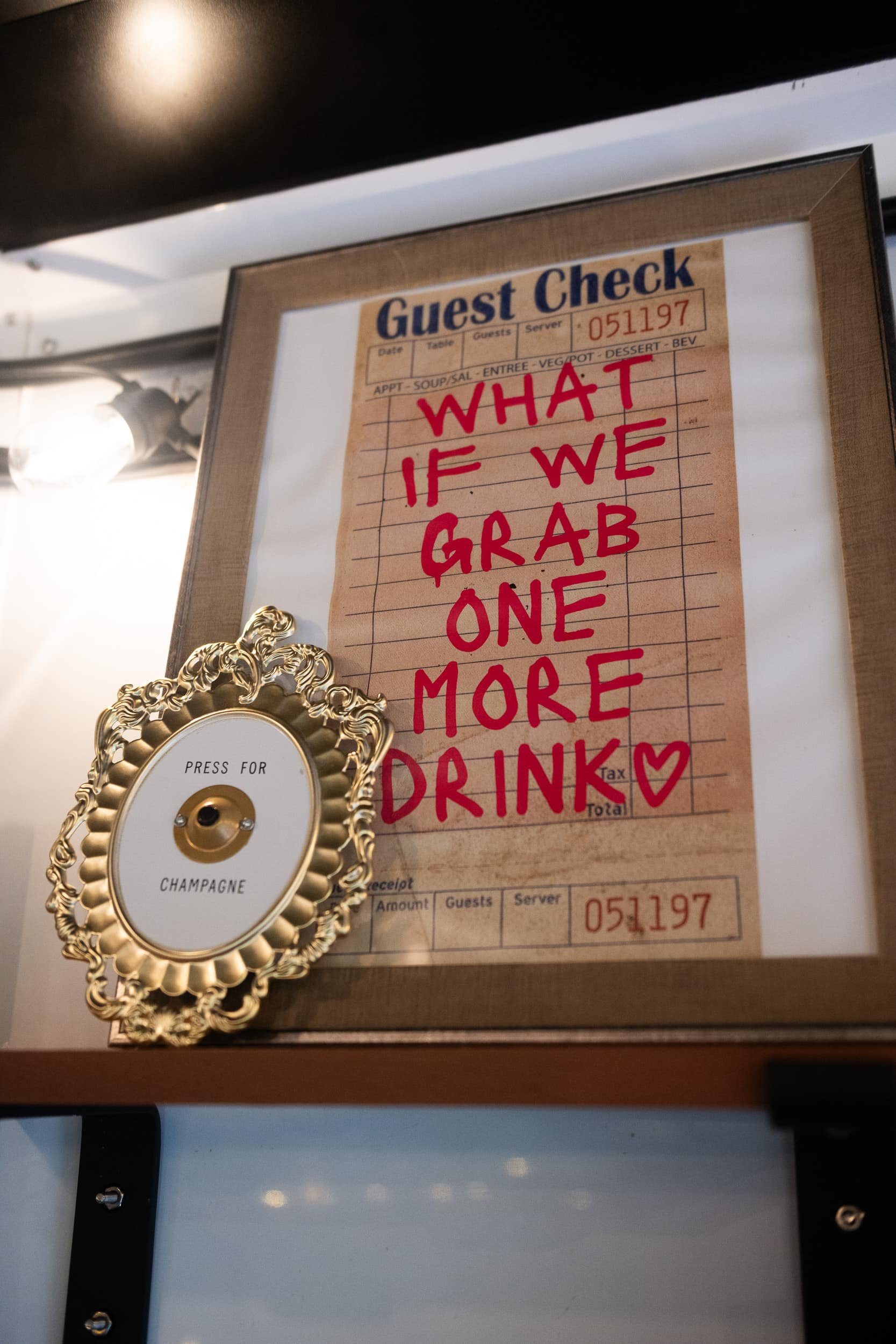 Champagne Quarters horse trailer mobile bar closeup of a shelf inside the horse trailer with decor, serving special event cocktails.