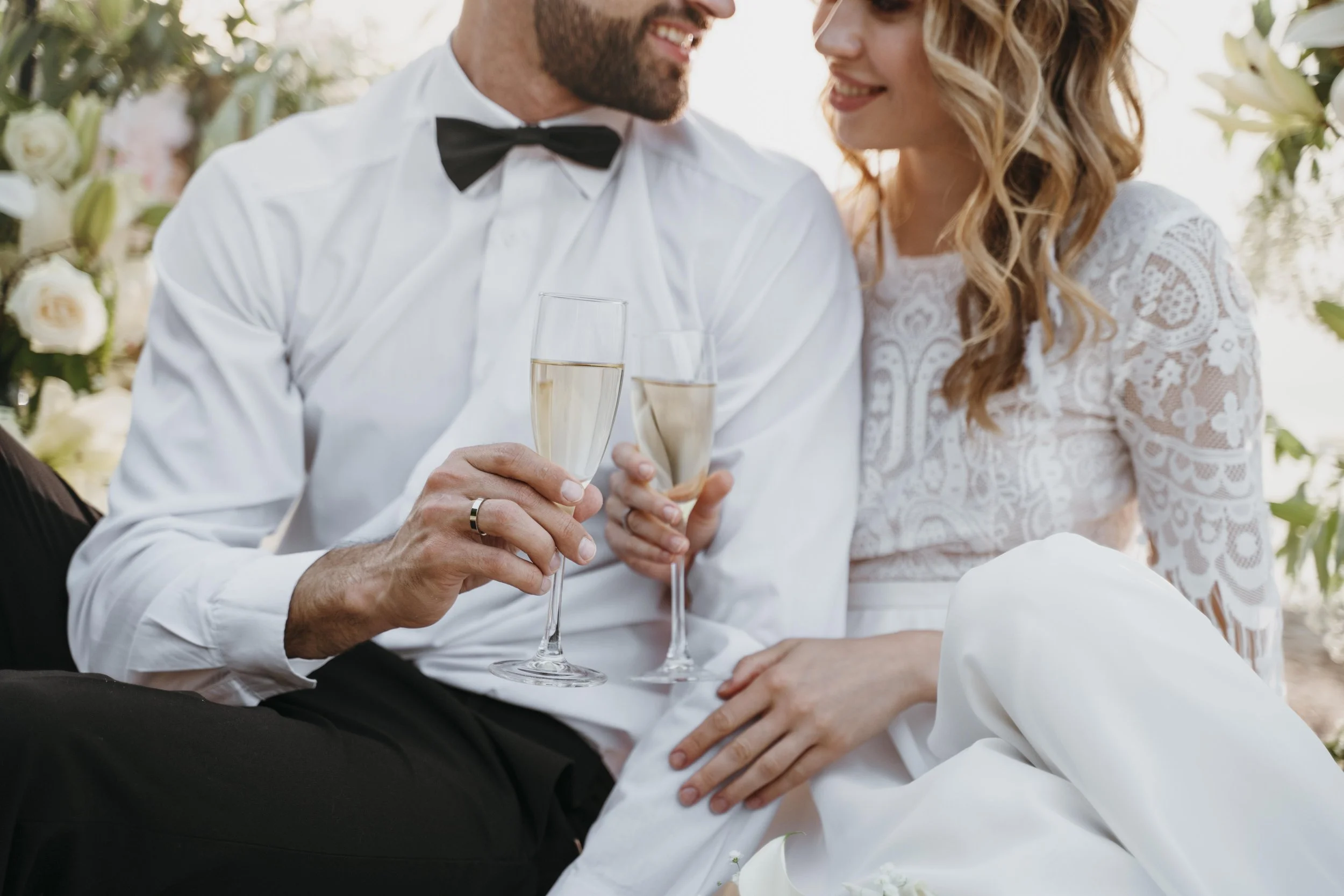 Bride and groom enjoying a glass of champagne on their wedding day.