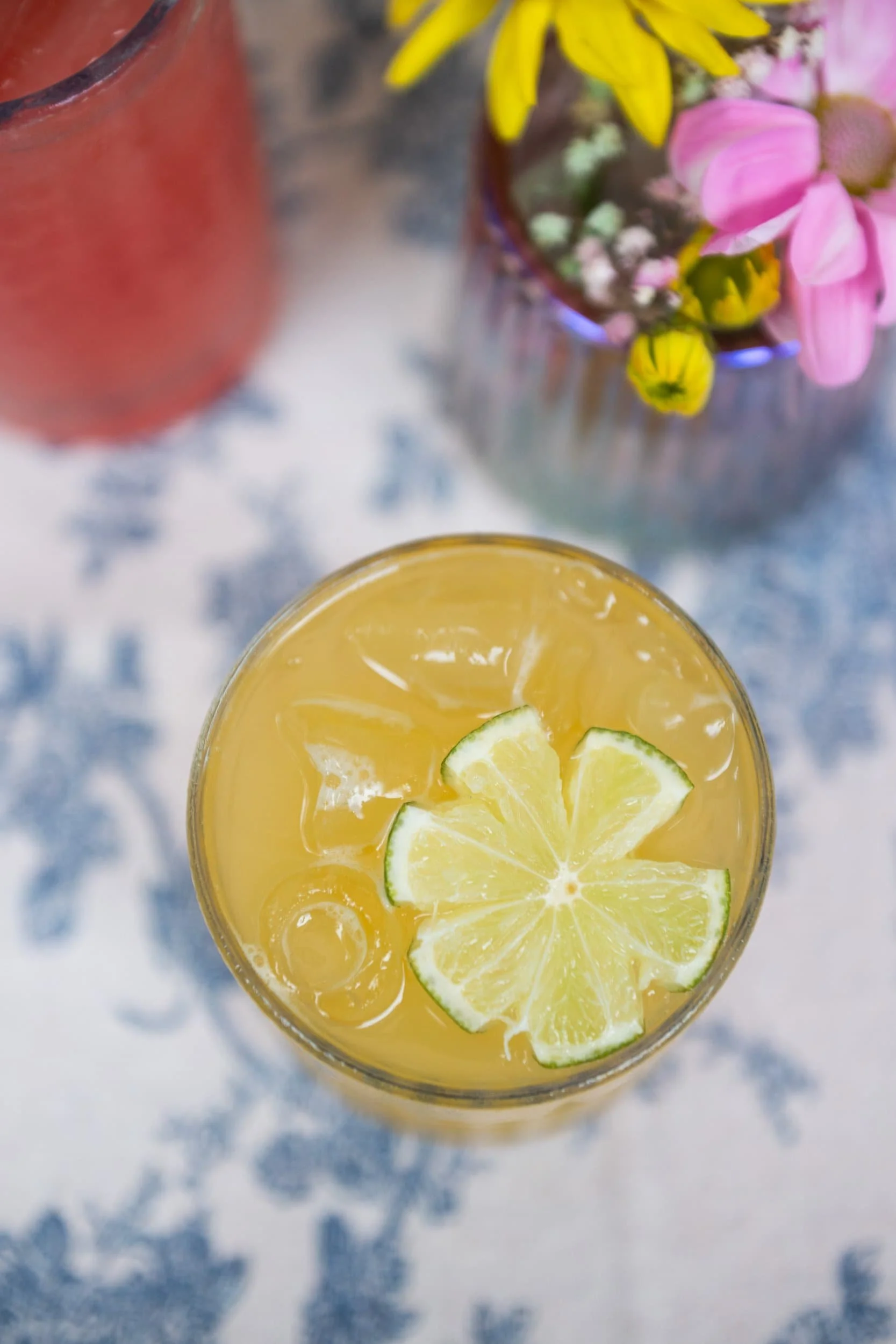 Champagne Quarters, mobile bar in Maryland and Virginia, serves up a peach margarita with a lime flower.