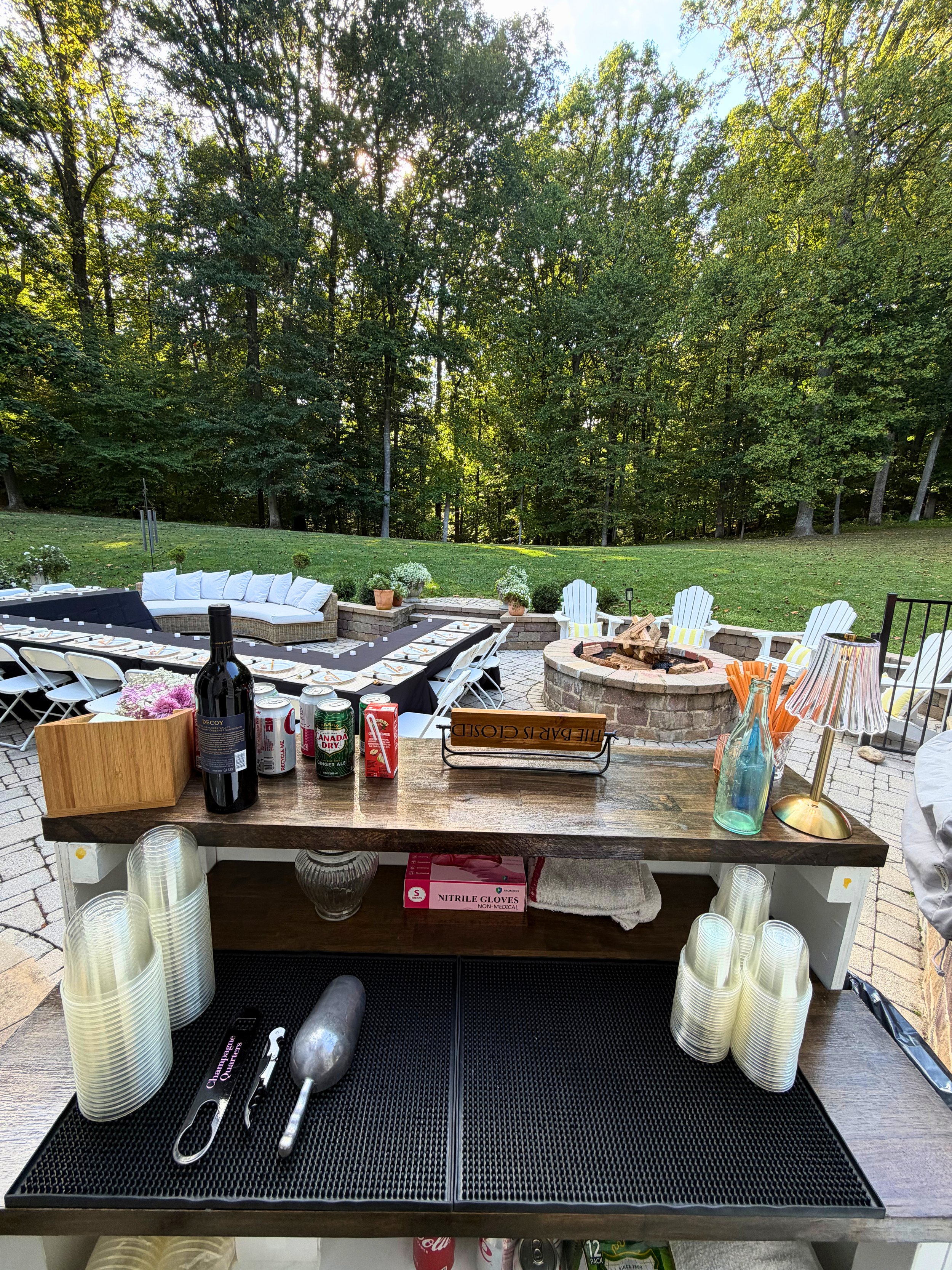 Serving at a backyard party from one of our Palomino wooden bars. Maryland mobile bar services.