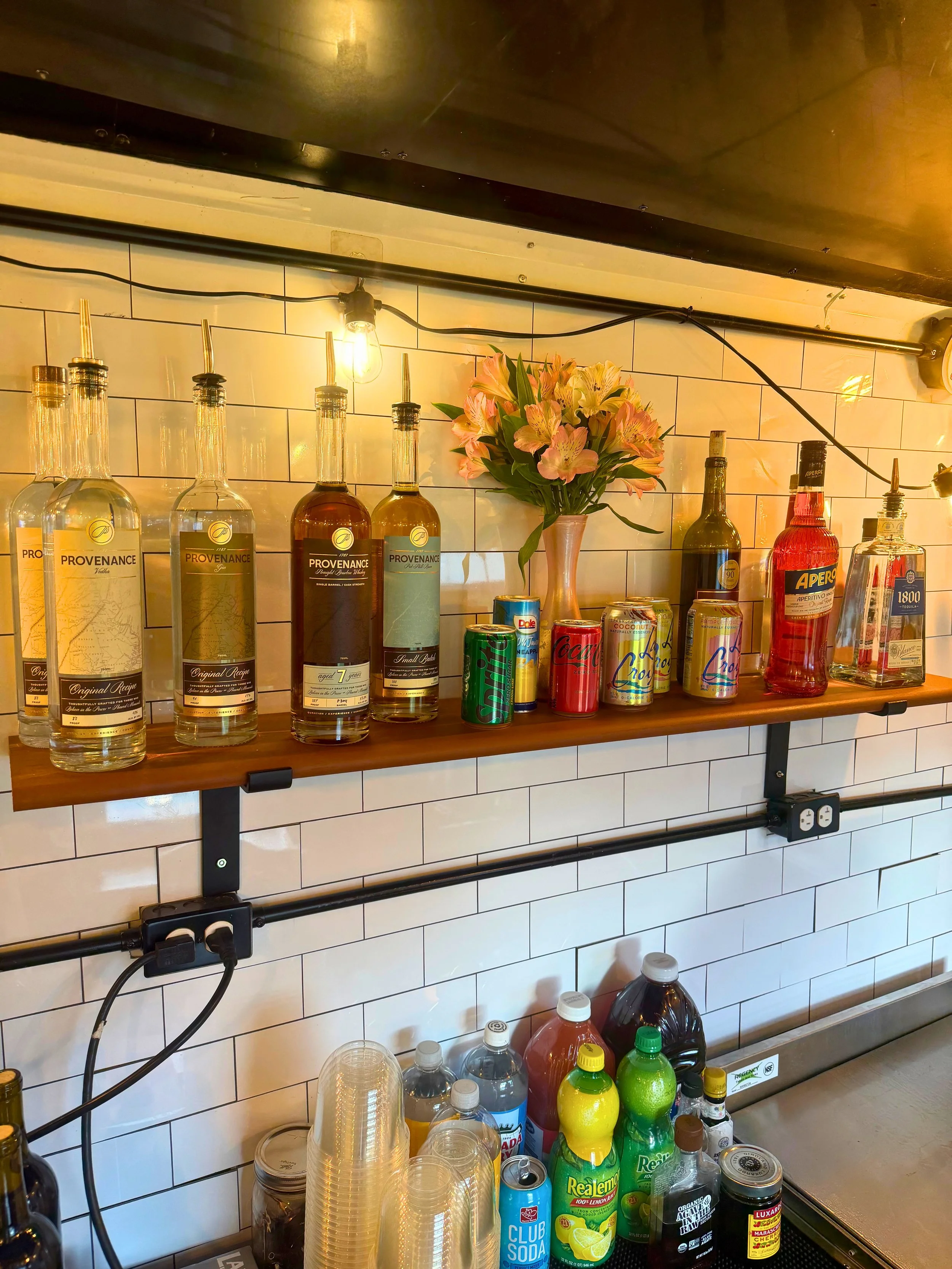 Liquor display on shelf for mobile bar trailer. Maryland mobile bar services.
