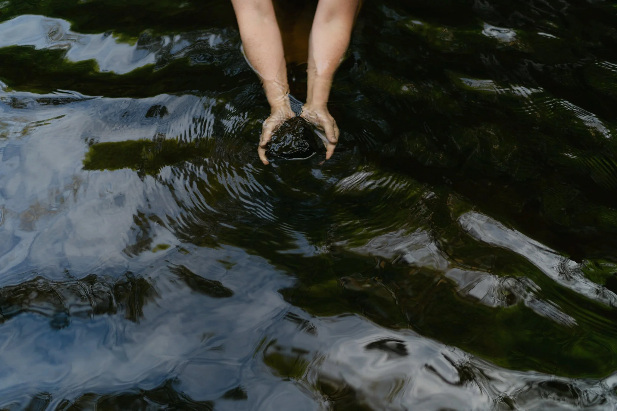 Feminine portrait in nature in Scotland, sensory experience with water
