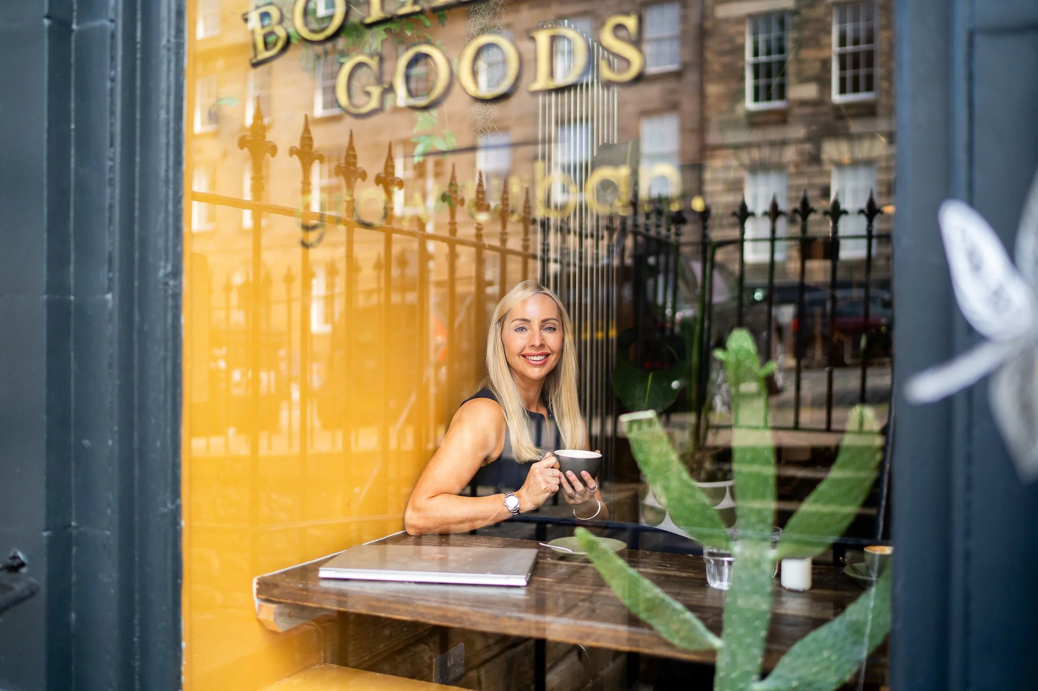 female mortgage broker sitting in a cafe in Edinburgh