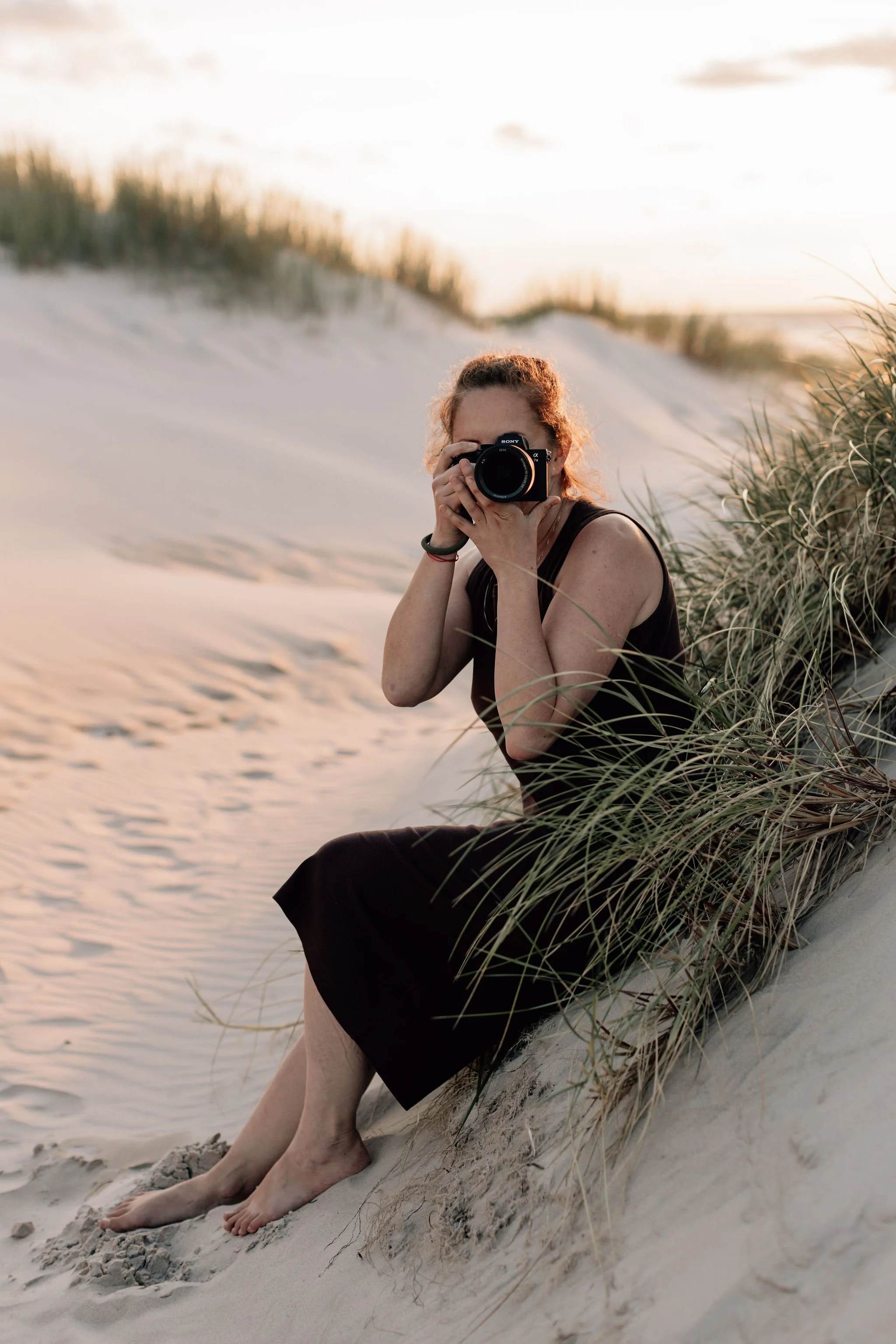 female photographer on the beach