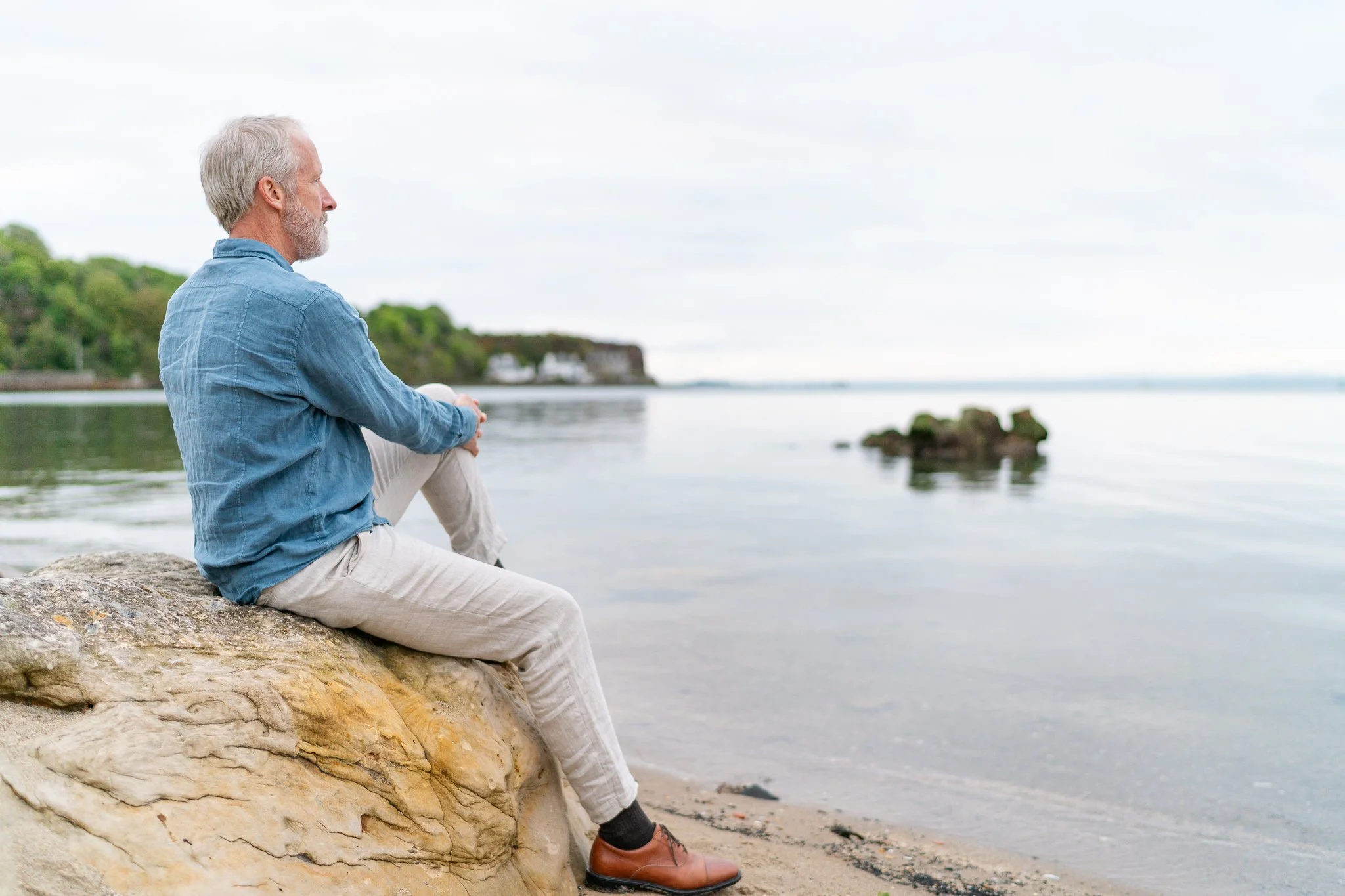 holistic medicine doctor photographed on the beach at sunrise in Fife