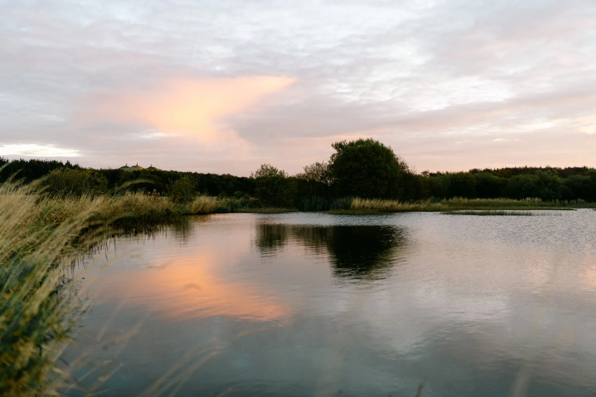 small loch photographed in the soft light of sunrise