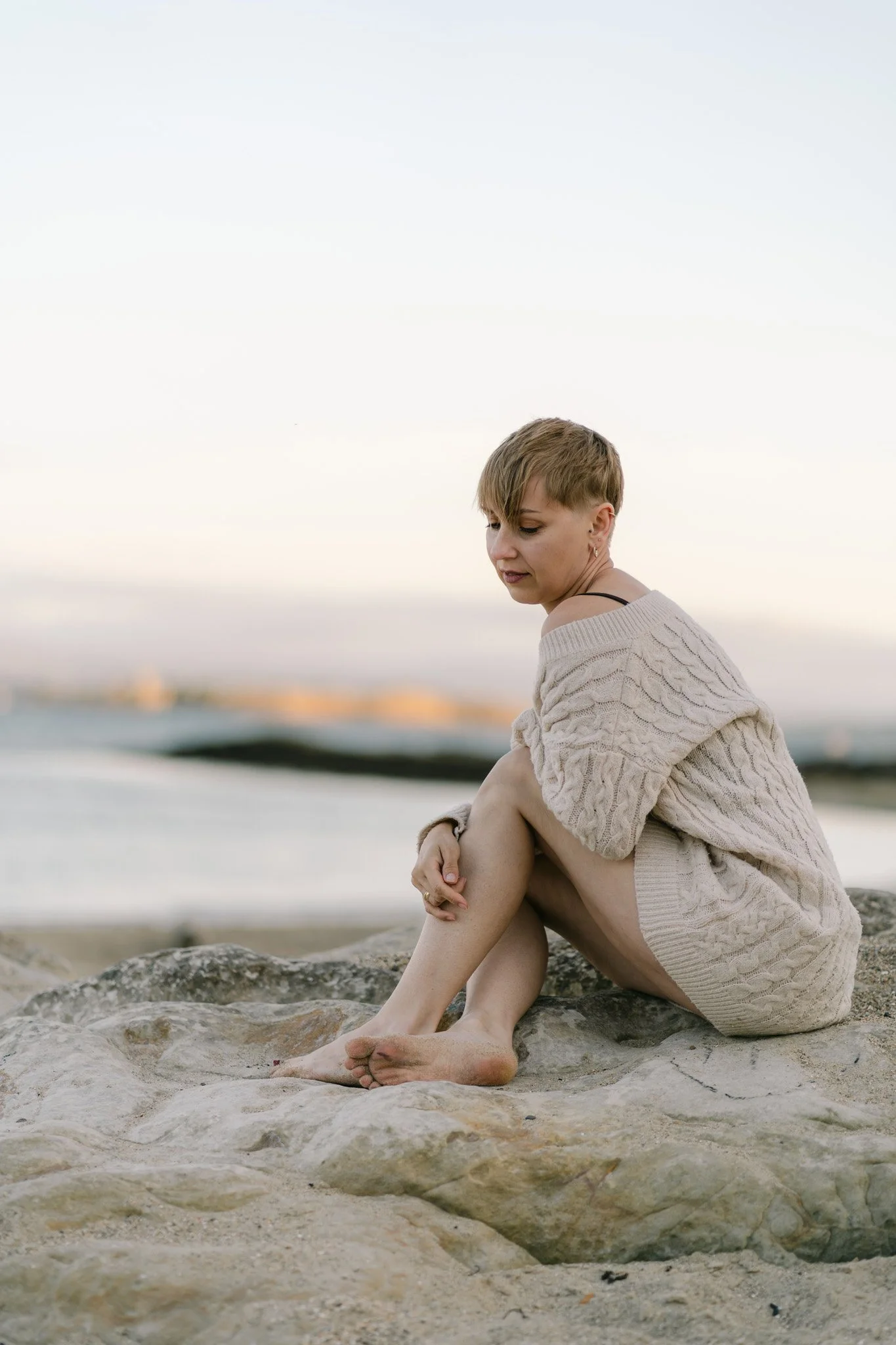 beautiful portrait of a woman on the beach in Fife scotland at sunset
