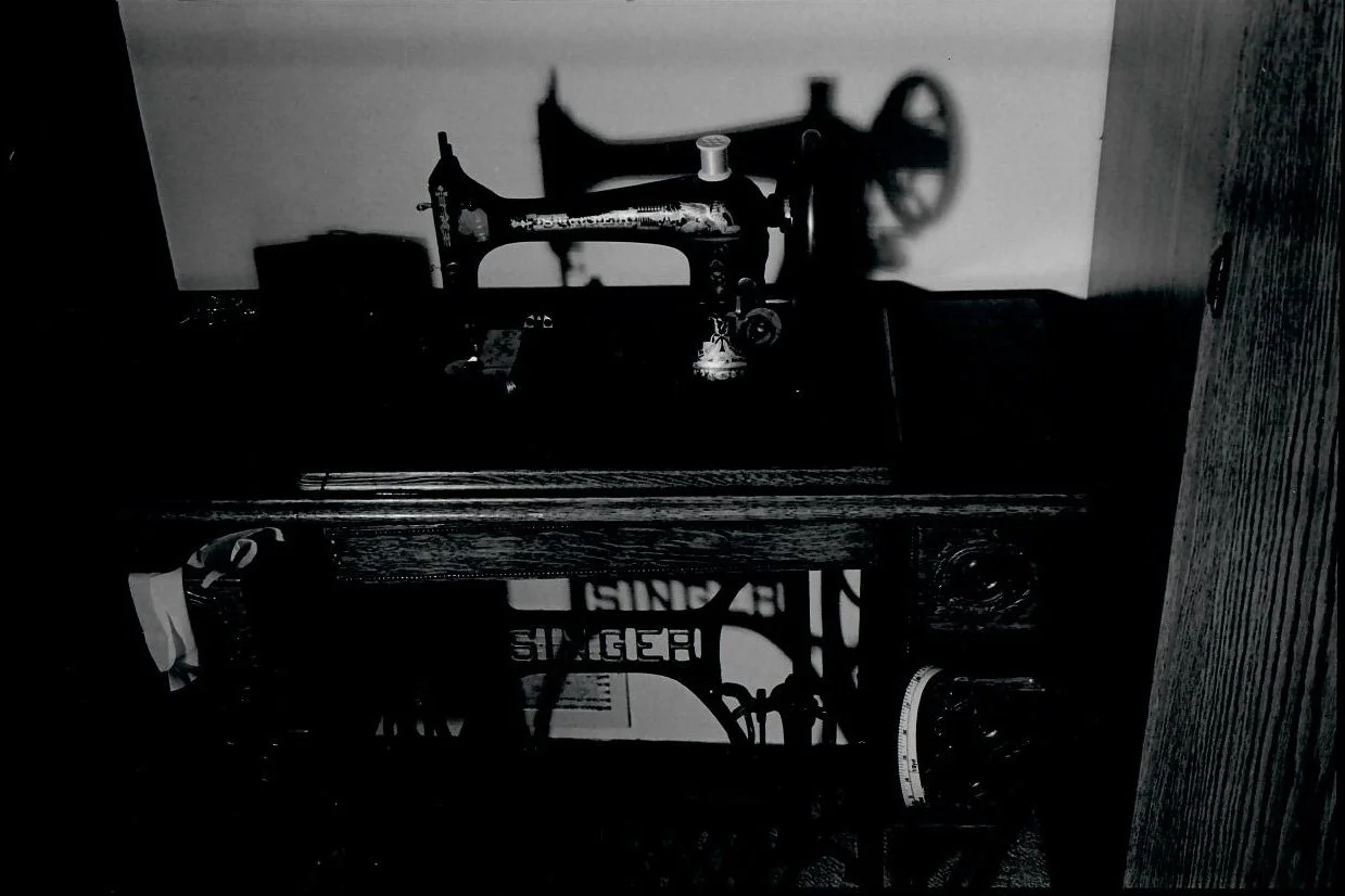 This Singer Sewing Machine is one that my grandmother inherited. This photo focuses more on the deep contract between the sewing machine itself and its shadow.
