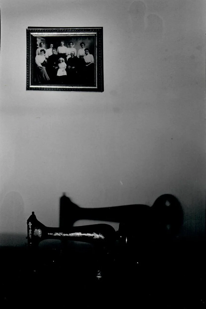 This Singer Sewing Machine is one that my grandmother inherited. This photo however, focuses more in the negative space between the sewing machine and the photo. 