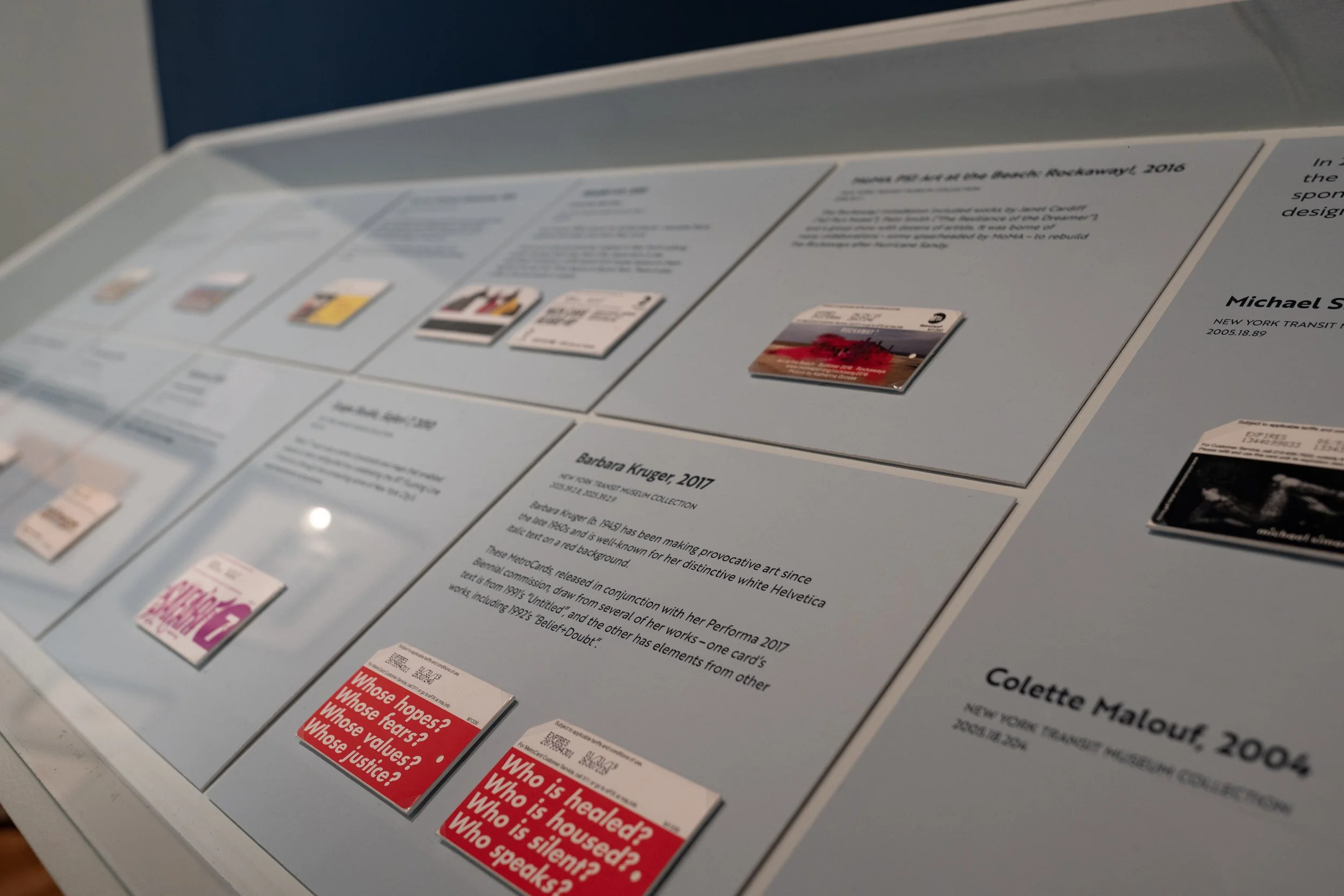 Case featuring multiple MetroCards featuring artists and designers